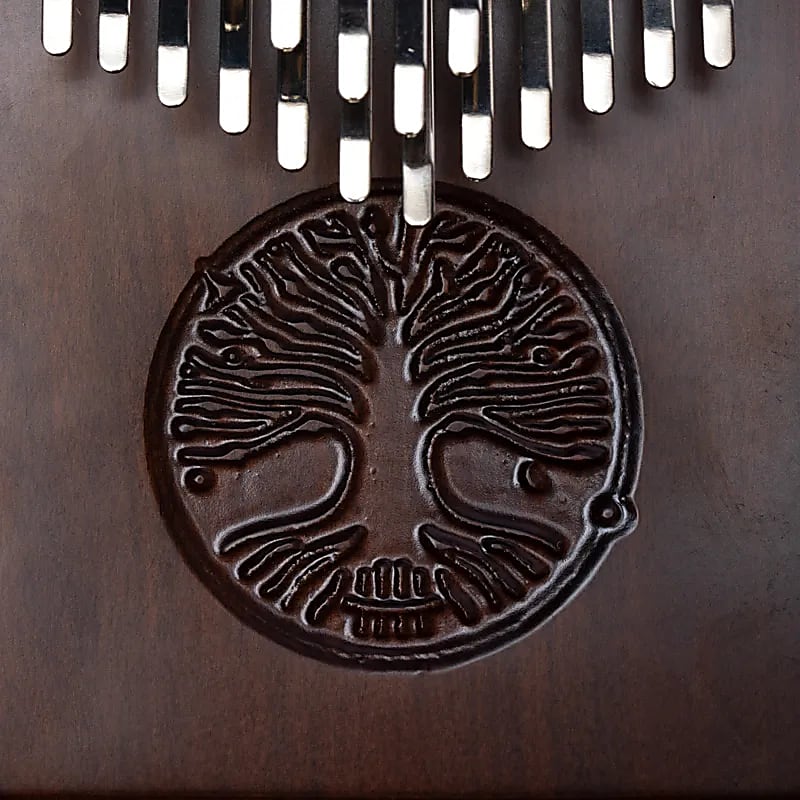 Kalimba/ Hluru or 'finger piano'! 24 notes, made of American walnut wood. Sold with a microphone. Decorated with a carved Tree of Life. Comes with a cloth bag and a tuning hammer!