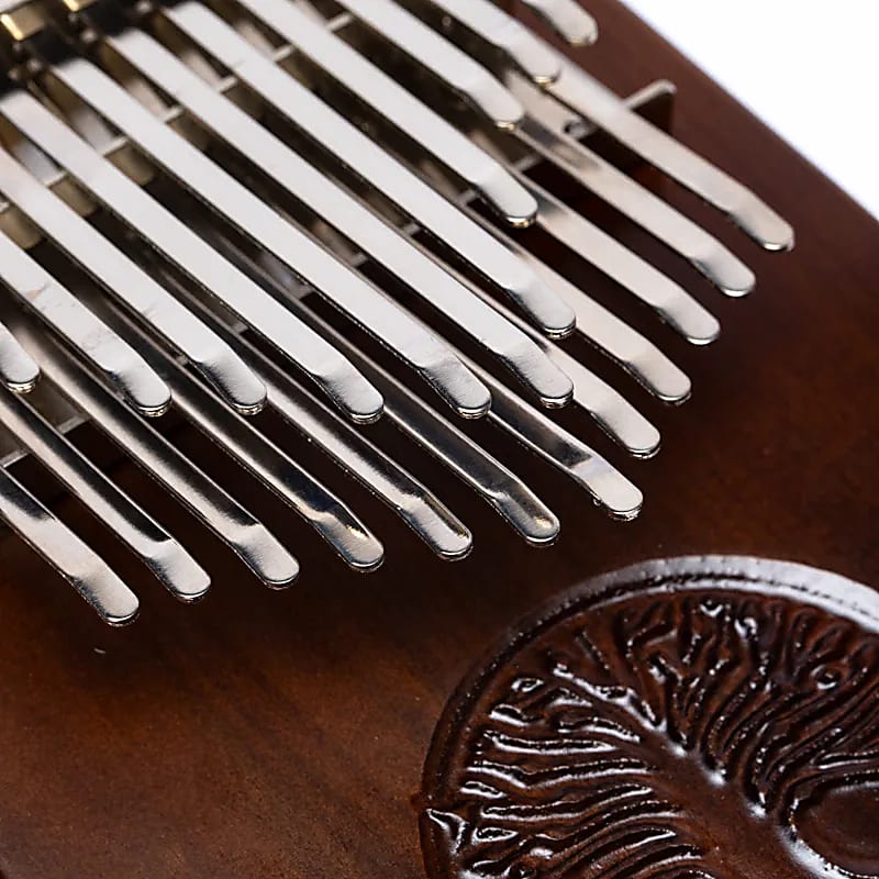 Kalimba/ Hluru or 'finger piano'! 24 notes, made of American walnut wood. Sold with a microphone. Decorated with a carved Tree of Life. Comes with a cloth bag and a tuning hammer!