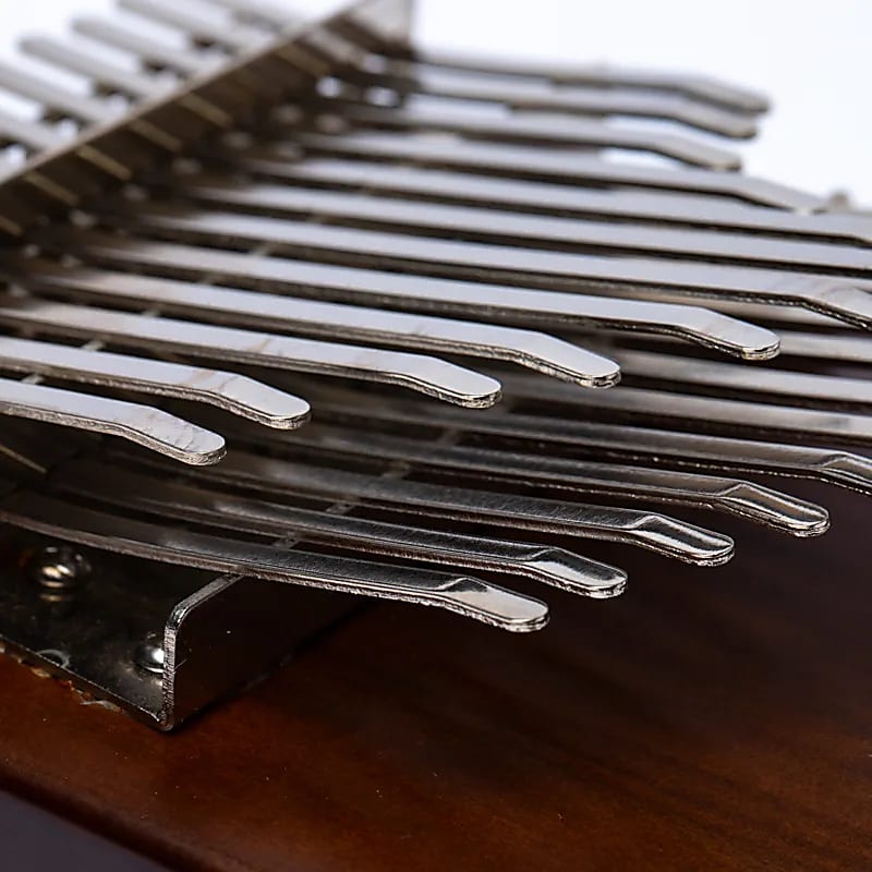 Kalimba/ Hluru or 'finger piano'! 24 notes, made of American walnut wood. Sold with a microphone. Decorated with a carved Tree of Life. Comes with a cloth bag and a tuning hammer!