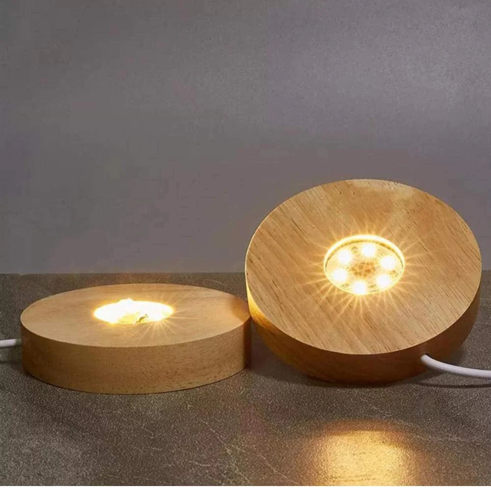 Base LED en bois avec adaptateur USB pour éclairer vos plus belles pièces. Dimensions (Ø x H) : 10 x 2 cm Puissance : 5V Vendu avec son adaptateur USB/220V. Peut être utilisé pour les lampes en sélénite, les prismes, pointes et sphères., parfait !