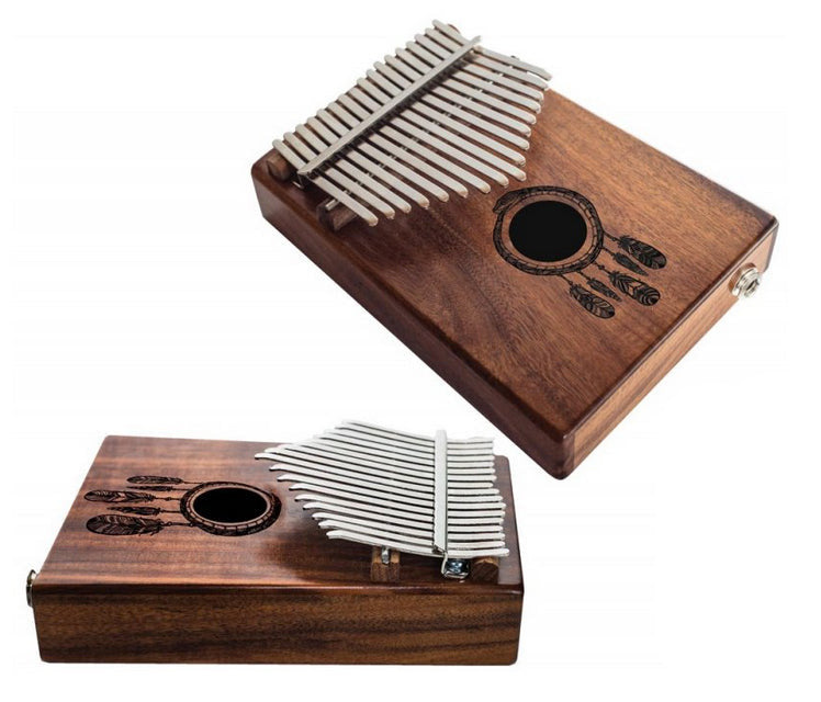 The kalimba or finger piano! 17 notes, made of koa wood (tropical resonance wood) in the key of C major. Decorated with a carved Indian motif and comes with a cloth bag and a tuning hammer! 23x19x7.5 cm!