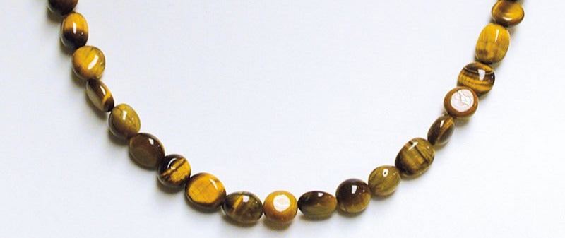 Oeil de tigre, bracelet de 17 à 21cm, collier de 42cm et sautoir de 60cm. Perles de type 'Graine' de formes naturelles montées sur fil de haute résistance !