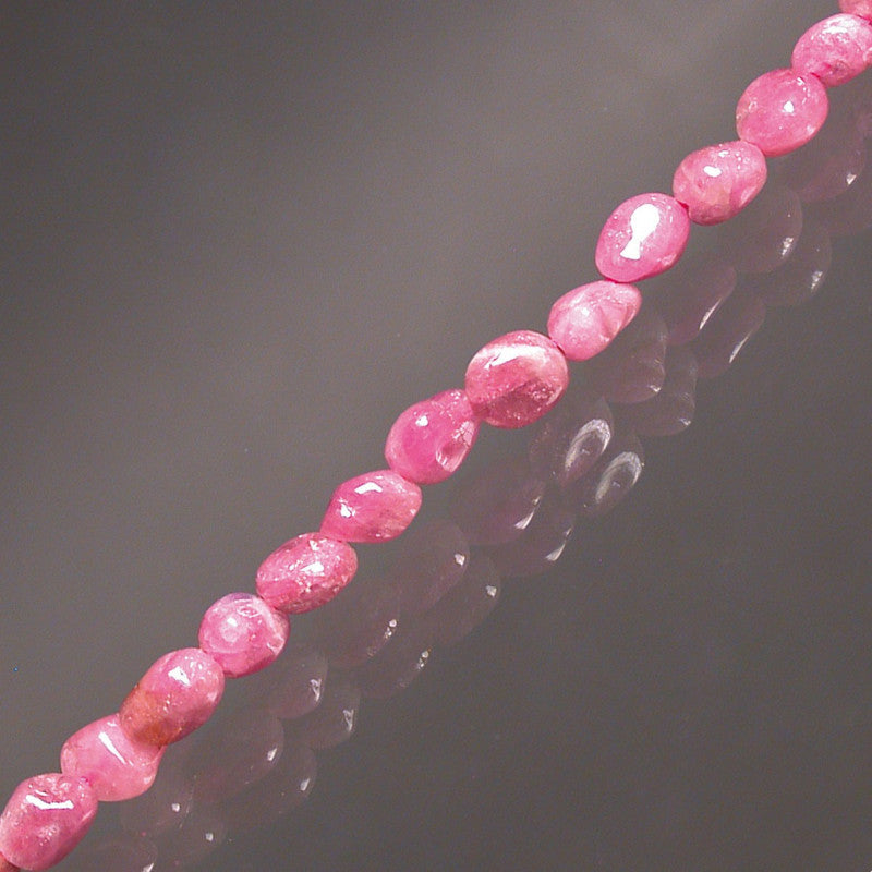 Pink tourmaline called 'Rubellite', bracelet from 17 to 21cm, necklace from 42cm and sautoir from 60cm. Naturally shaped 'Seed' type beads mounted on high-strength wire!