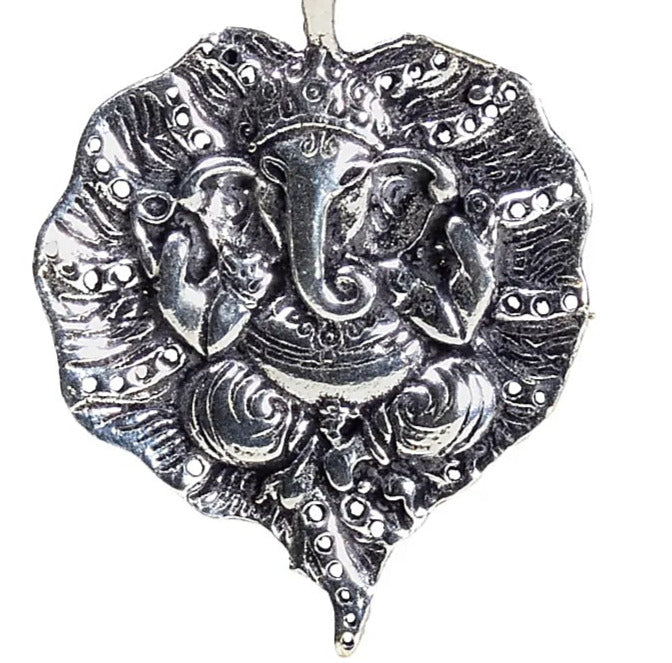 Pendant of the Hindu god Ganesh (or Ganesha, Ganapati), also known as the Elephant God, the lord who bestows good luck, prosperity, and success. 4.5 centimeters - 8 grams / Sold with an adjustable black leather cord!