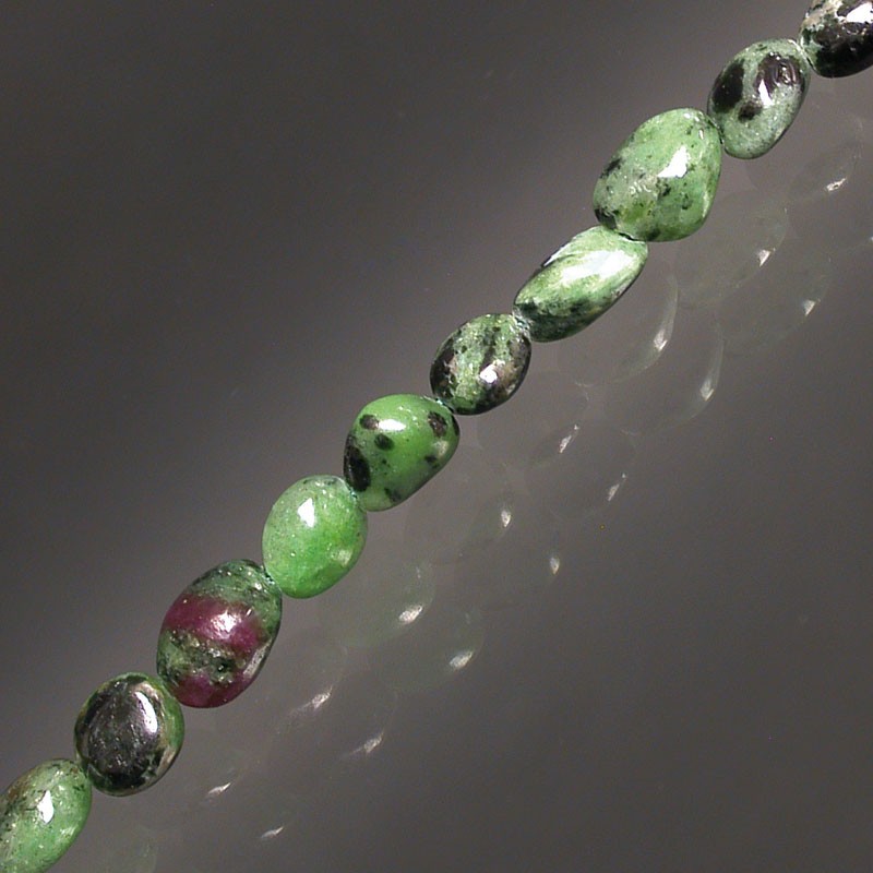 Ruby zoisite, 17 to 21cm bracelet, 42cm necklace and 60cm sautoir. Naturally shaped 'Seed' beads mounted on high-strength wire!