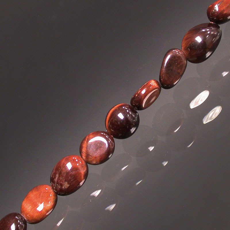Oeil de taureau, bracelet de 17 à 21cm, collier de 42cm et sautoir de 60cm. Perles de type 'Graine' de formes naturelles montées sur fil de haute résistance !