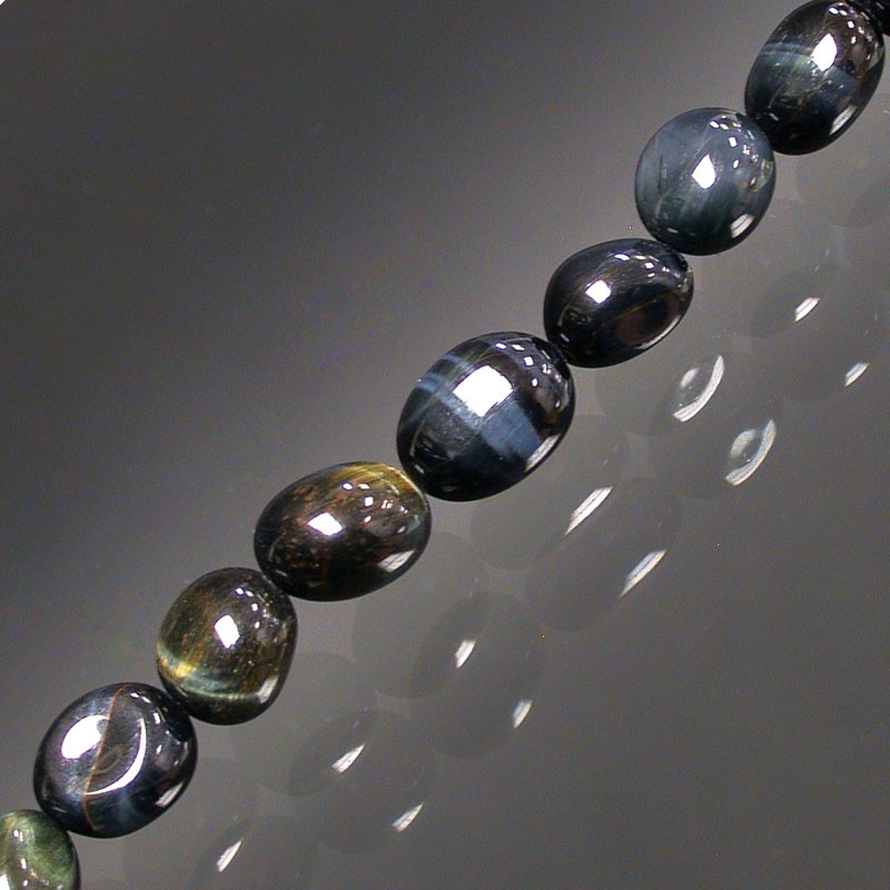 Oeil de faucon, bracelet de 17 à 21cm, collier de 42cm et sautoir de 60cm. Perles de type 'Graine' de formes naturelles montées sur fil de haute résistance !