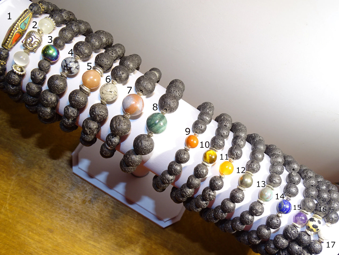 Lava Stone Bracelet Collection... Made from 8mm lava beads and a semi-precious stone bead. Available in lengths from 17 to 21 centimeters. Handmade by Gem & Zen!