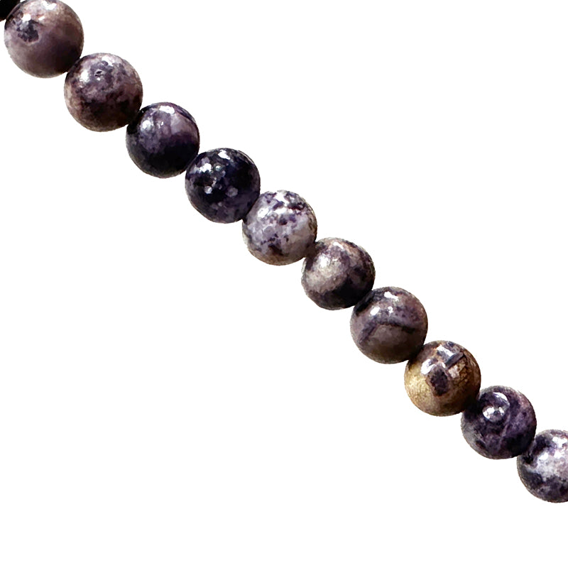 Charoite, perles rondes de 6 ou 8 mm. Vendu en bracelet de 17 à 21 cm ou en collier de 45. Qualité AA à AAA, superbes perles !