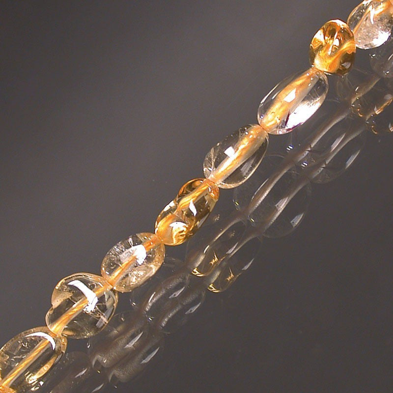 Citrine, bracelet de 17 à 21cm, collier de 42cm et sautoir de 60cm. Perles de type 'Graine' de formes naturelles montées sur fil de haute résistance !