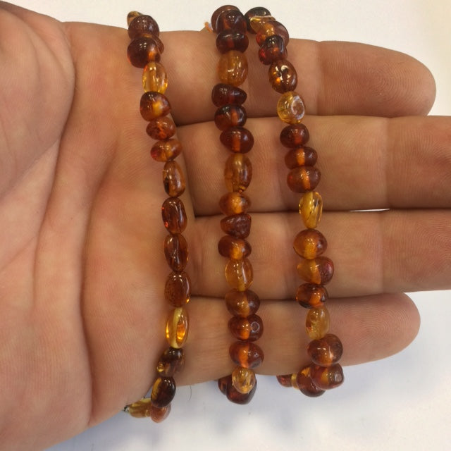 Création Gem & Zen, Mala de 108 perles en perle d'Ambre de 70 centimètres de longueur environ. Qualité AA à AAA, superbe pièce avec pochette de rangement offerte !