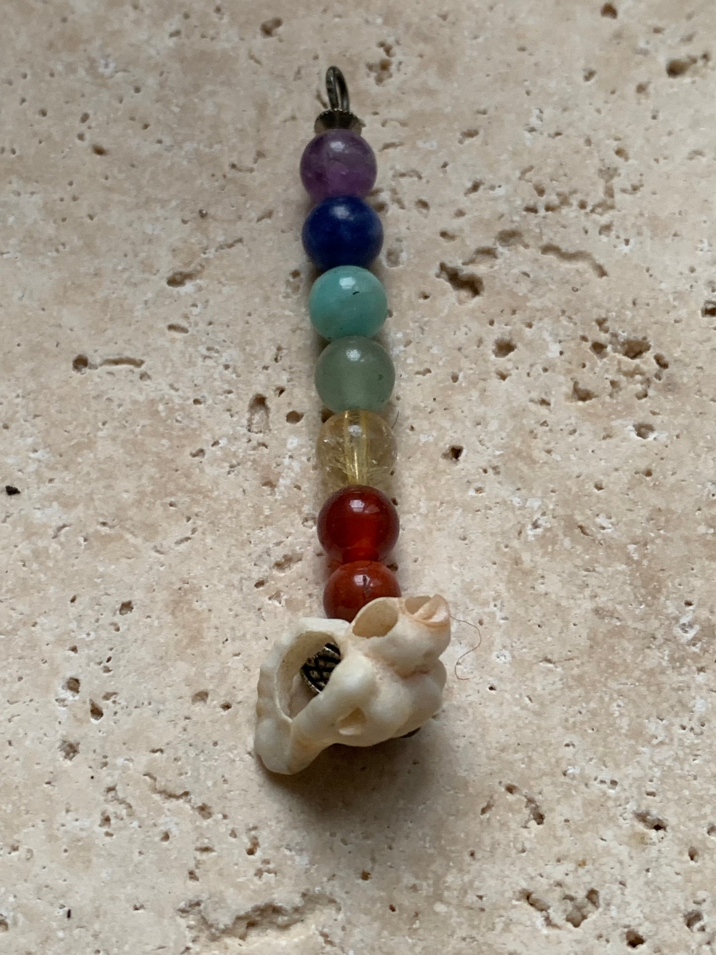 '7 chakras' pendant made by Gem & Zen, choice of 7 beads with or without a natural shell! 52 millimeters high x 6 millimeters in diameter. Sold with an adjustable black cord!