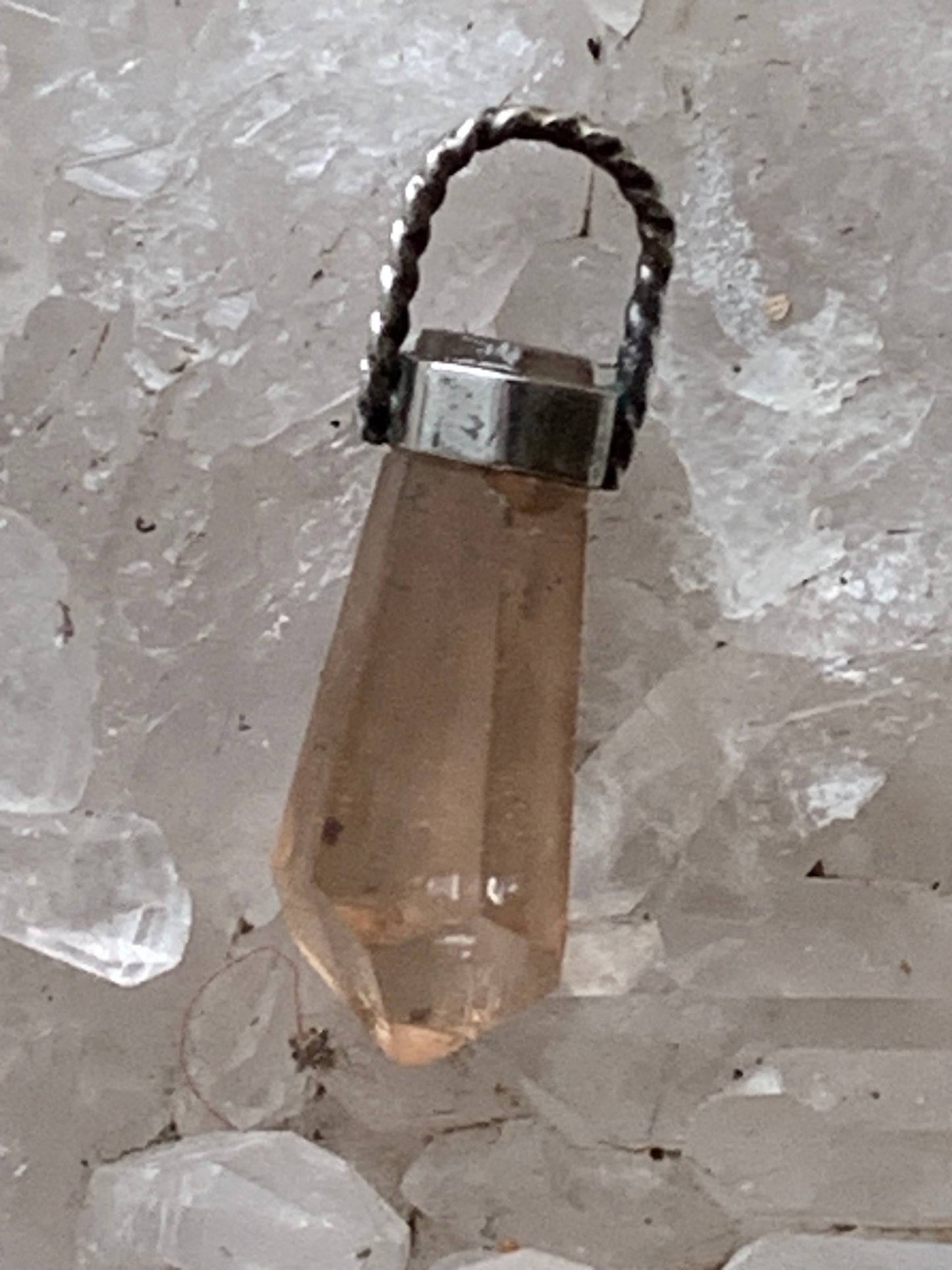 Aquamarine pendant set in silver with a metal design! Unique piece measuring 38 millimeters high x 12 millimeters wide x 8 millimeters thick. Sold with an adjustable black cord. Made in Pakistan!