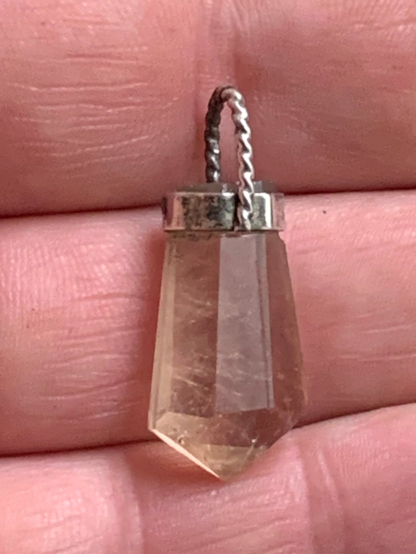 Aquamarine pendant set in silver with a metal design! Unique piece measuring 38 millimeters high x 12 millimeters wide x 8 millimeters thick. Sold with an adjustable black cord. Made in Pakistan!