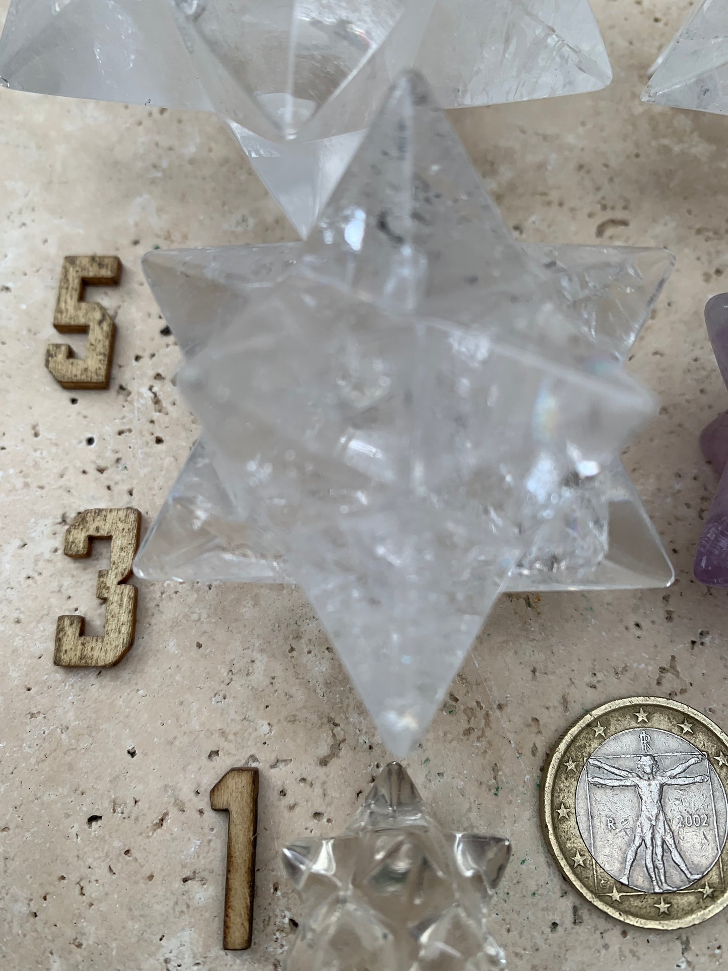 Etoile de Sirius (12 branches) en cristal de roche/ quartz et améthyste. Modèle au choix vendu à l'unité, de 1,5 à 6 cm. Parfait pour l'étude de la géométrie sacré et ses applications !