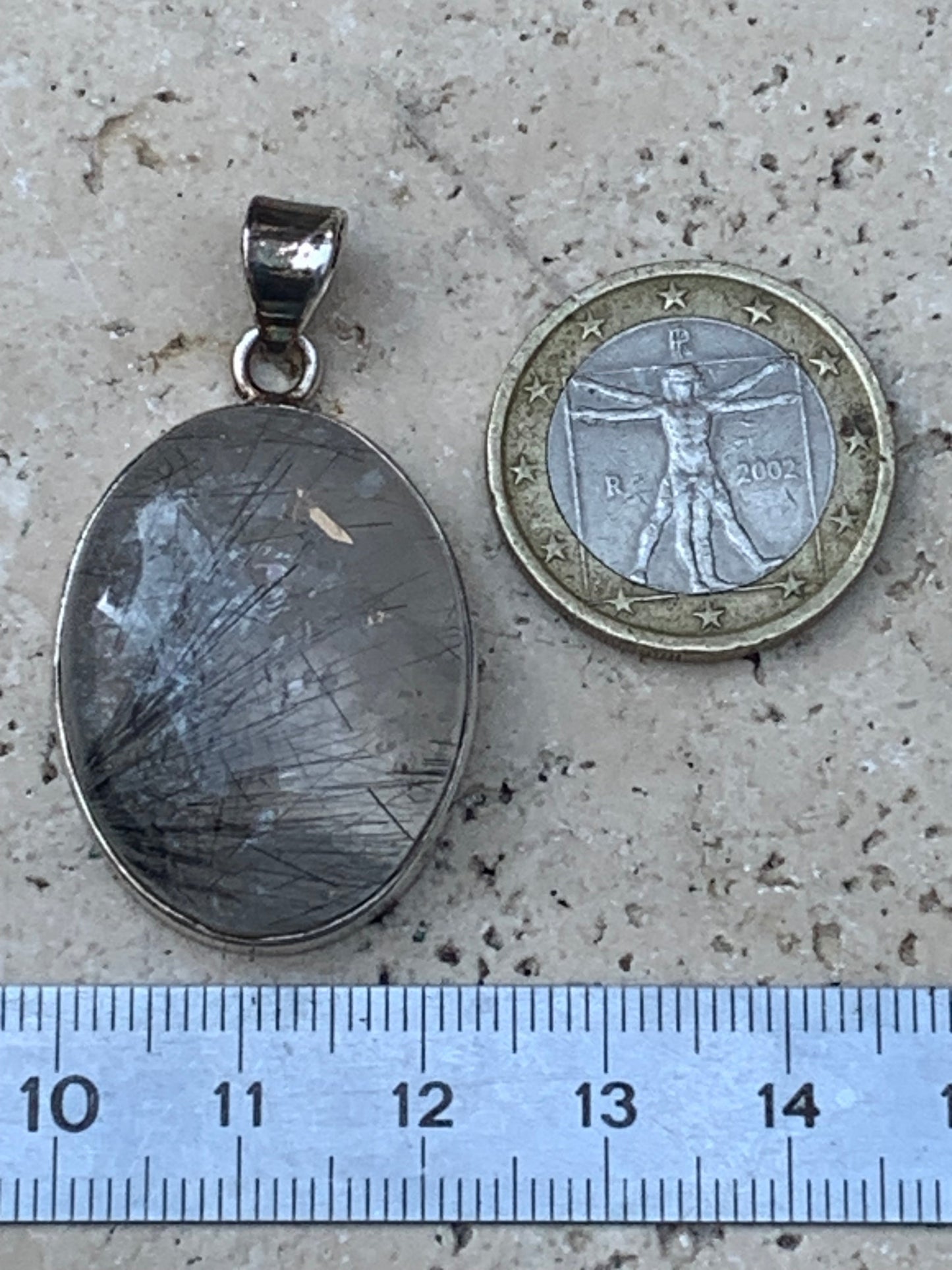 Rock crystal/quartz with black tourmaline inclusions! Silver pendant, 43 mm high x 25 mm wide x 10 mm thick. Sold with an adjustable black cord!