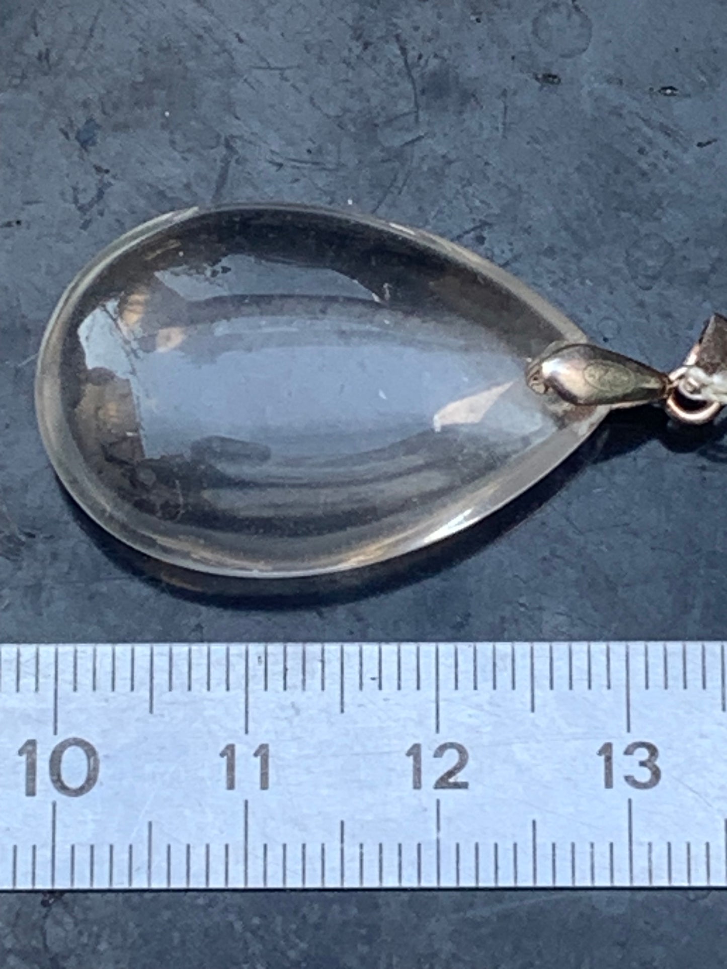 Rock crystal/quartz, AAA quality silver 'drop' pendant, 40mm high x 20mm wide x 9mm thick. Sold with an adjustable black cord! A crystal jewel, for those who love to walk between light and mystery!