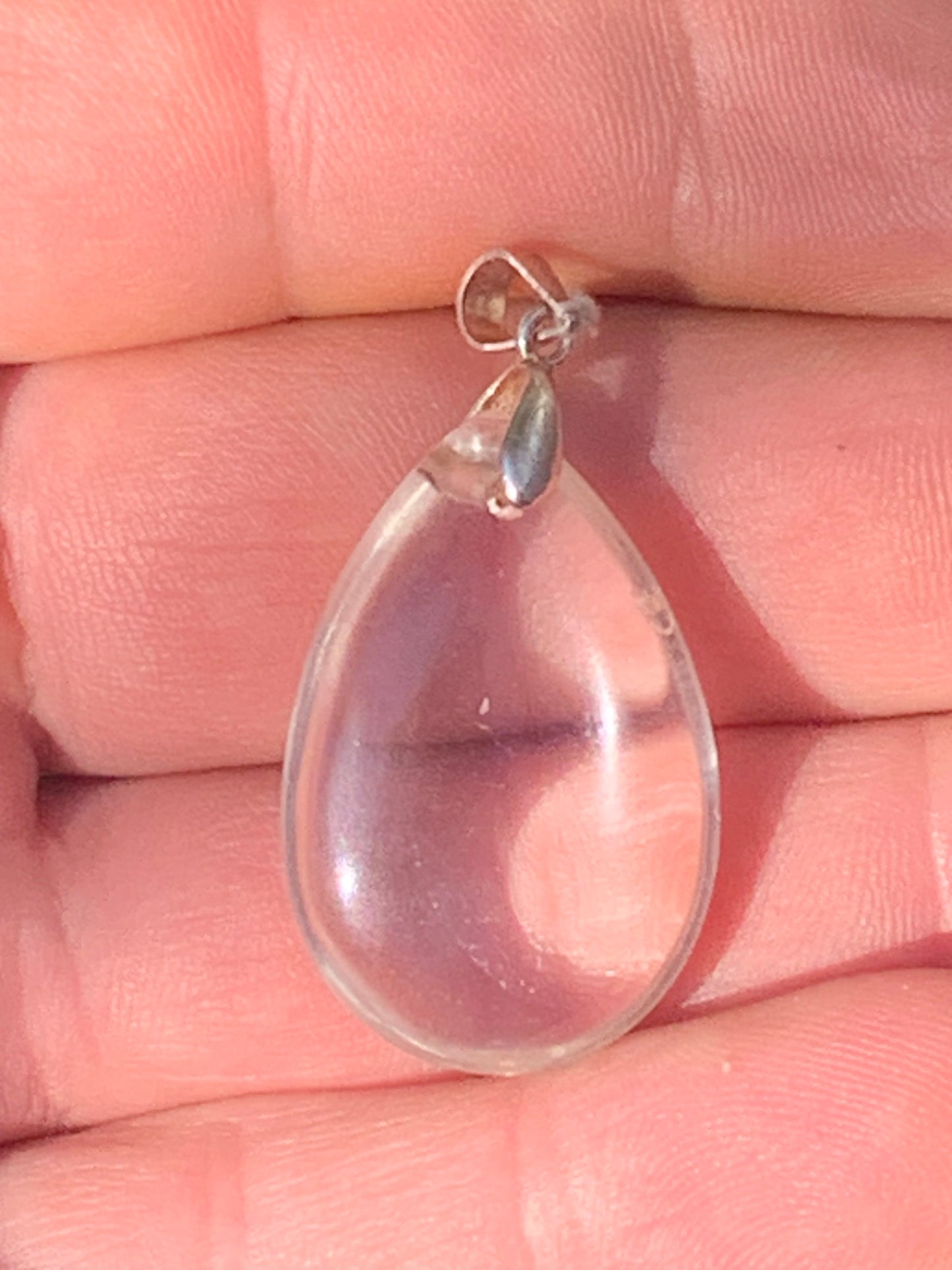 Rock crystal/quartz, AAA quality silver 'drop' pendant, 40mm high x 20mm wide x 9mm thick. Sold with an adjustable black cord! A crystal jewel, for those who love to walk between light and mystery!