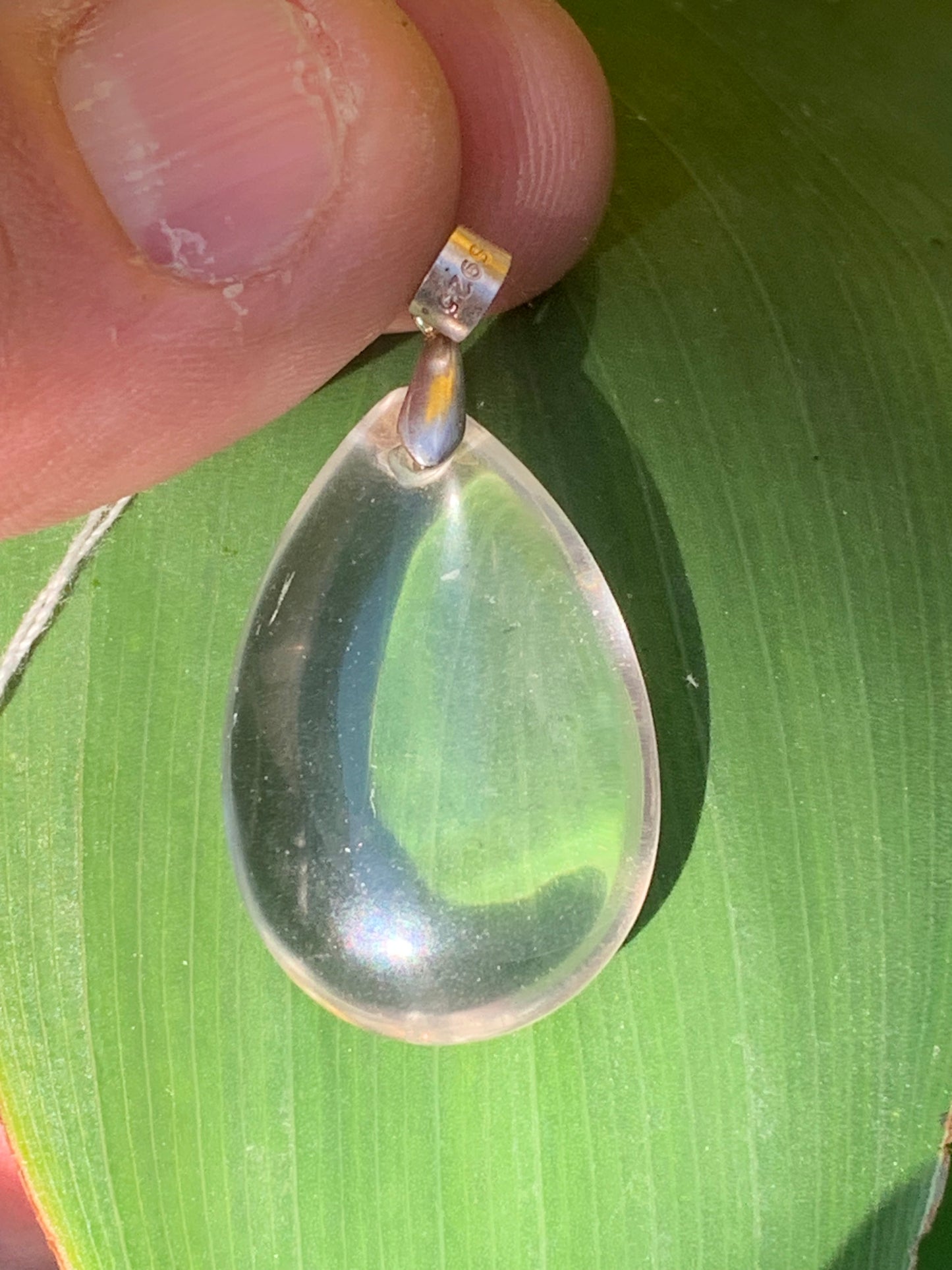 Rock crystal/quartz, AAA quality silver 'drop' pendant, 40mm high x 20mm wide x 9mm thick. Sold with an adjustable black cord! A crystal jewel, for those who love to walk between light and mystery!