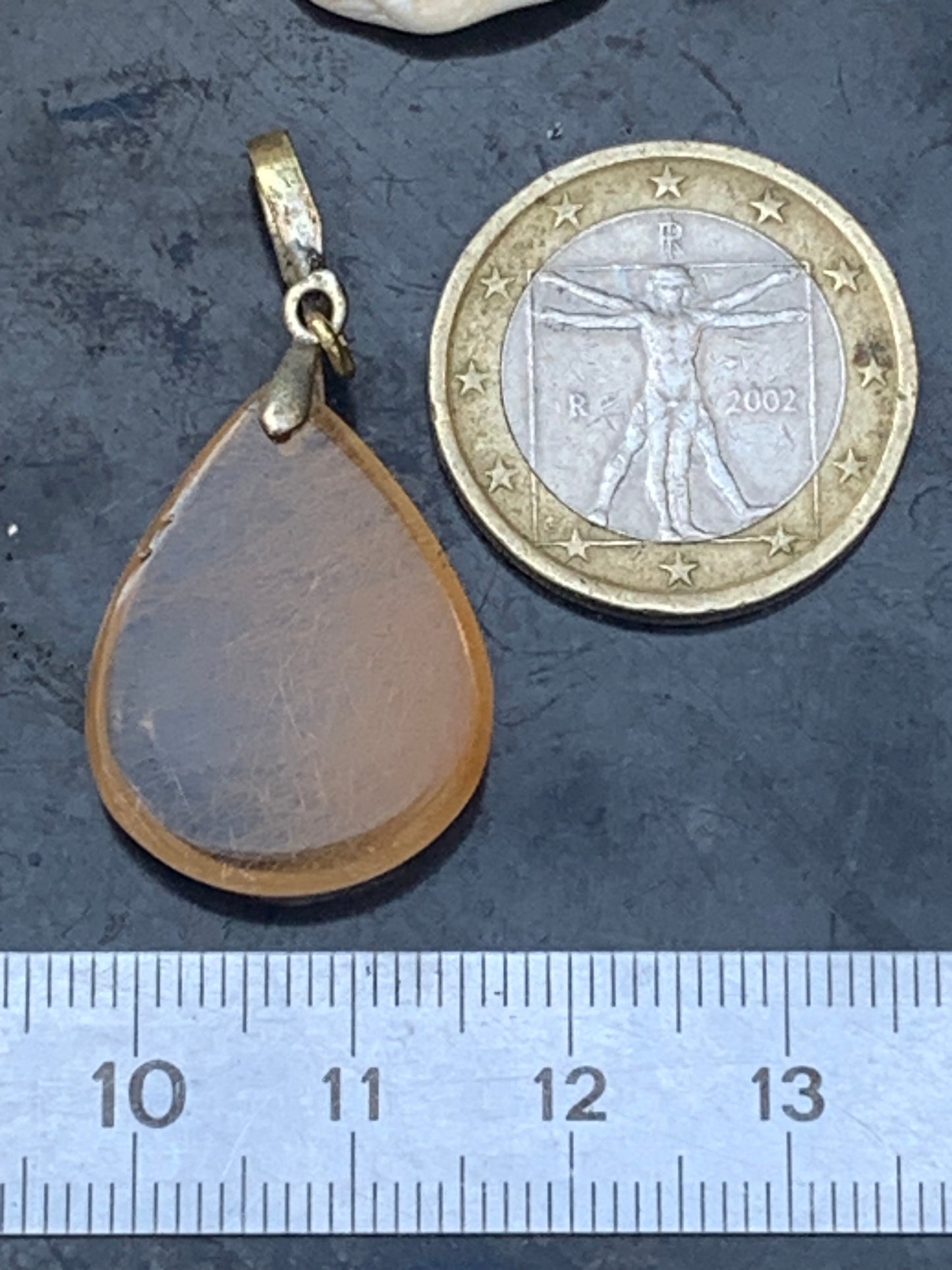 Rock crystal/quartz with golden rutile inclusions! Silver pendant, 40 mm high x 20 mm wide x 5 mm thick. Sold with an adjustable black cord!