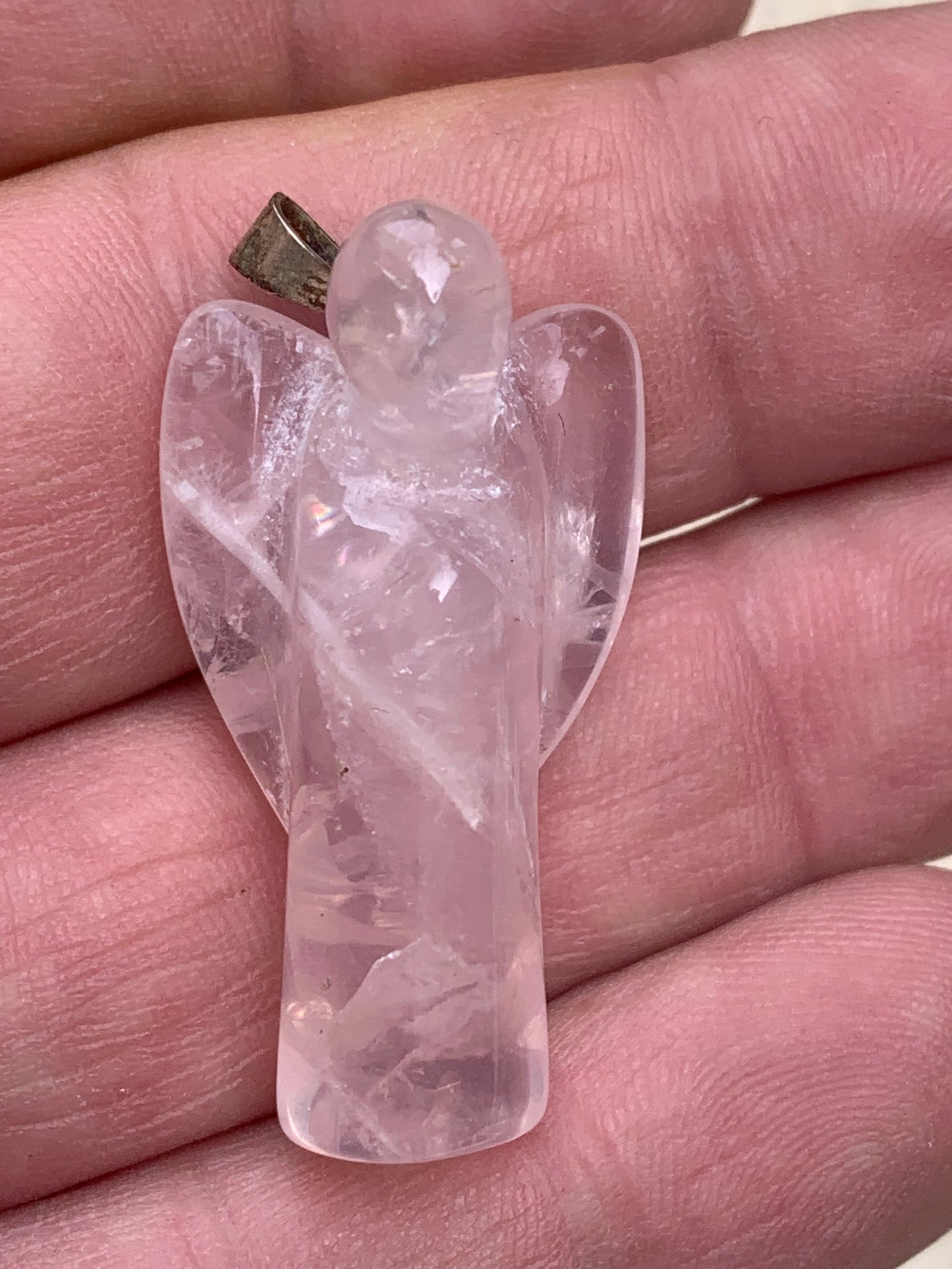 Rock crystal/Rose quartz! 'Angel' pendant measuring 40mm high x 18mm wide x 14mm thick. Sold with an adjustable black cord!