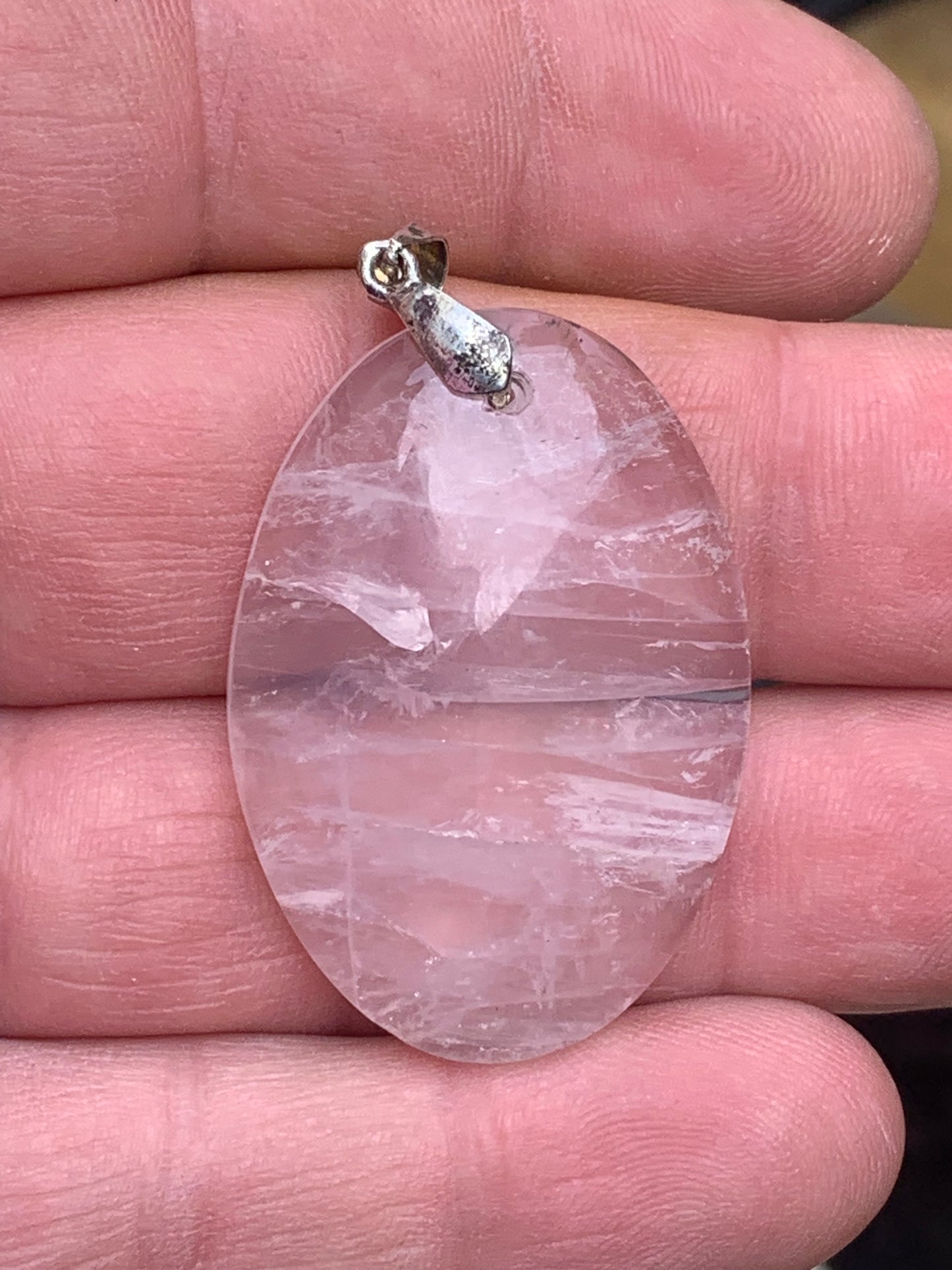 Rock crystal/Rose quartz! Pendant measuring 50mm high x 28mm wide x 8mm thick. Sold with an adjustable black cord!