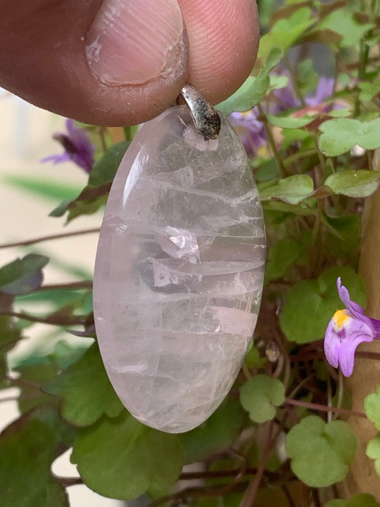 Rock crystal/Rose quartz! Pendant measuring 50mm high x 28mm wide x 8mm thick. Sold with an adjustable black cord!