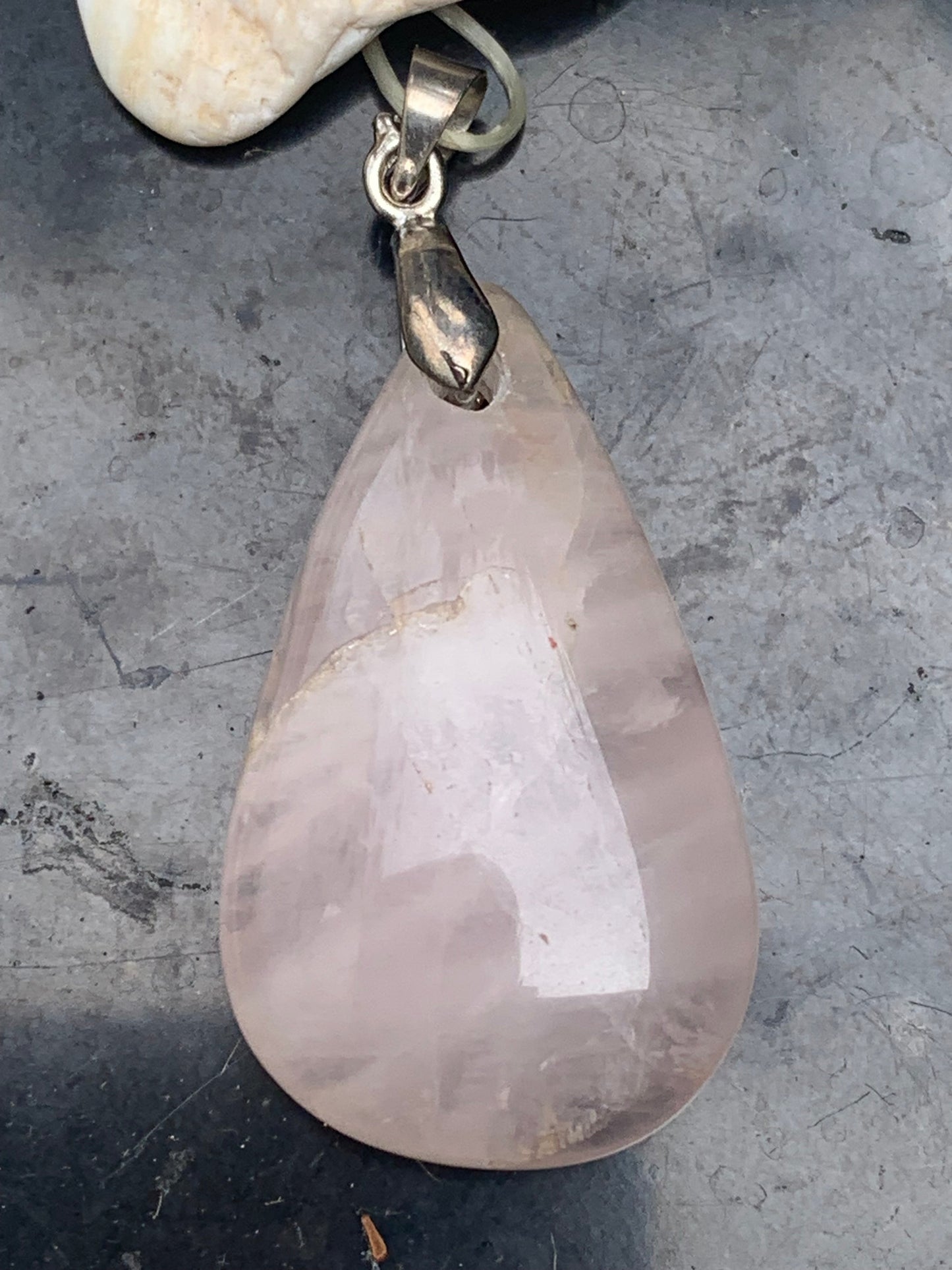 Rock crystal/Rose quartz! Pendant measuring 43mm high x 20mm wide x 8mm thick. Sold with an adjustable black cord!