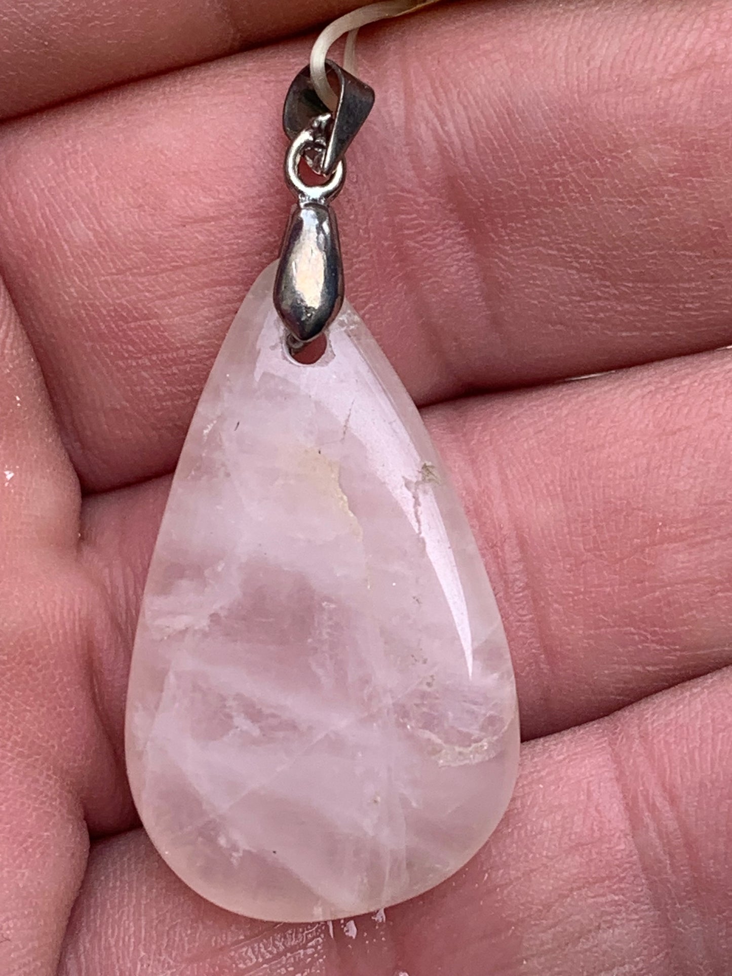 Rock crystal/Rose quartz! Pendant measuring 43mm high x 20mm wide x 8mm thick. Sold with an adjustable black cord!