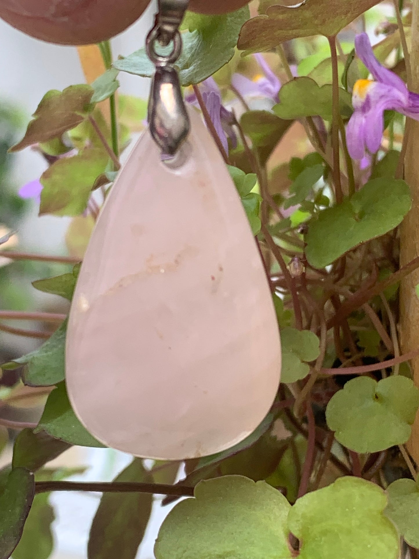 Rock crystal/Rose quartz! Pendant measuring 43mm high x 20mm wide x 8mm thick. Sold with an adjustable black cord!