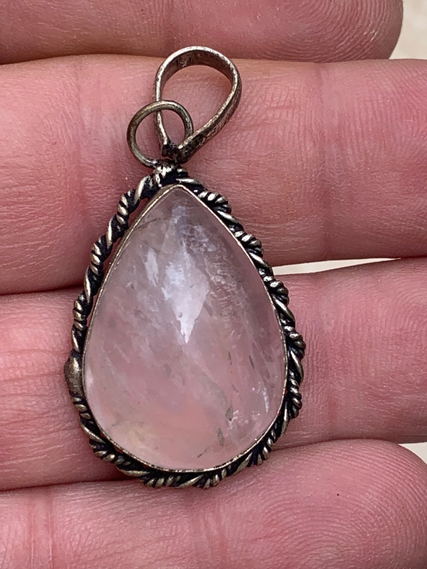 Rock crystal/Rose quartz! Pendant measuring 44mm high x 23mm wide x 12mm thick. Sold with an adjustable black cord!