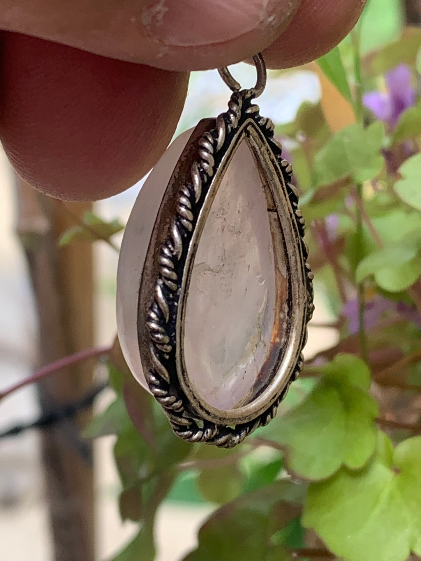 Rock crystal/Rose quartz! Pendant measuring 44mm high x 23mm wide x 12mm thick. Sold with an adjustable black cord!