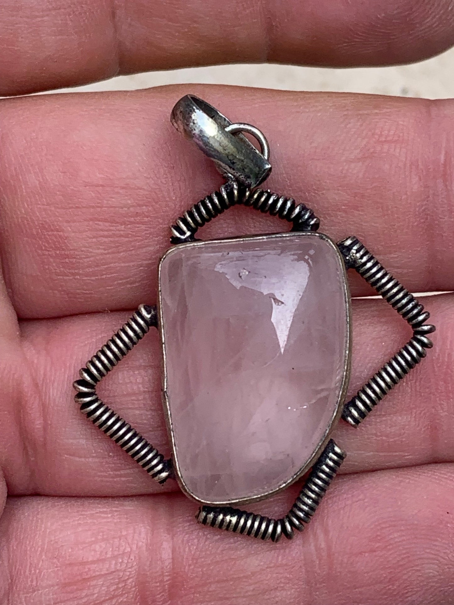 Rock crystal/Rose quartz! Pendant measuring 50mm high x 35mm wide x 10mm thick. Sold with an adjustable black cord!