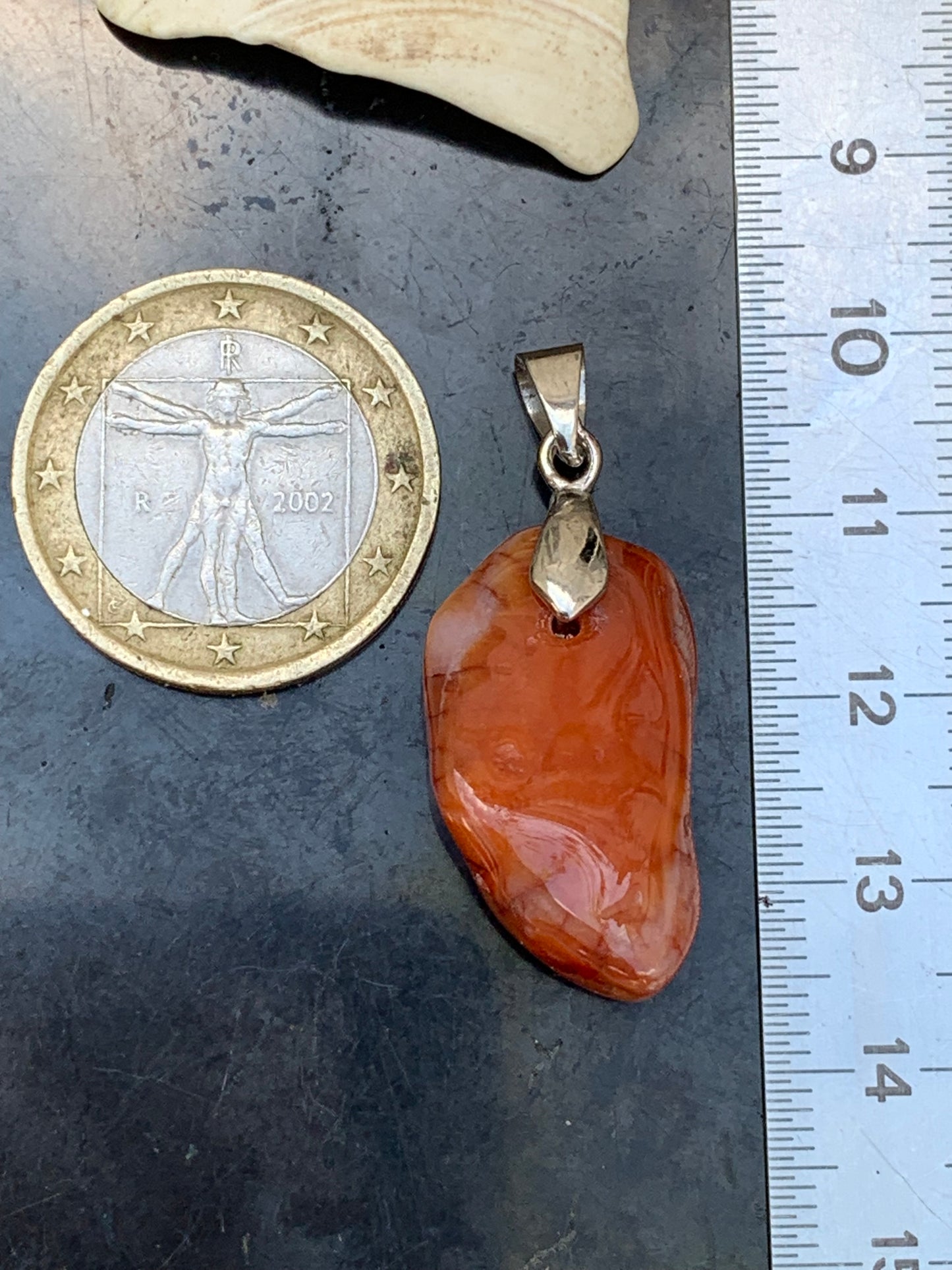 Carnelian pendant made by Gem & Zen, 35mm high x 14mm wide x 10mm thick. Sold with adjustable black cord!