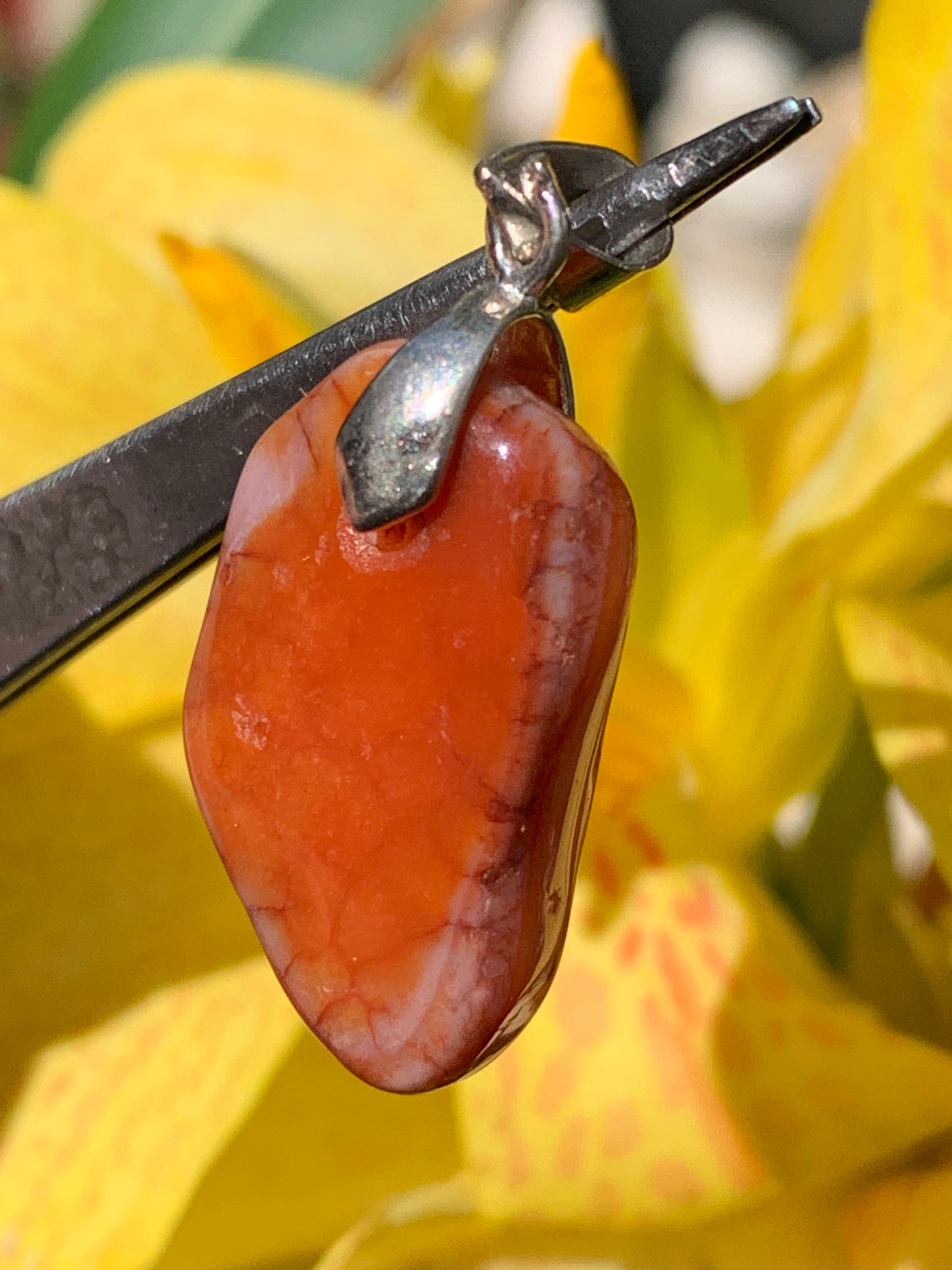 Carnelian pendant made by Gem & Zen, 35mm high x 14mm wide x 10mm thick. Sold with adjustable black cord!