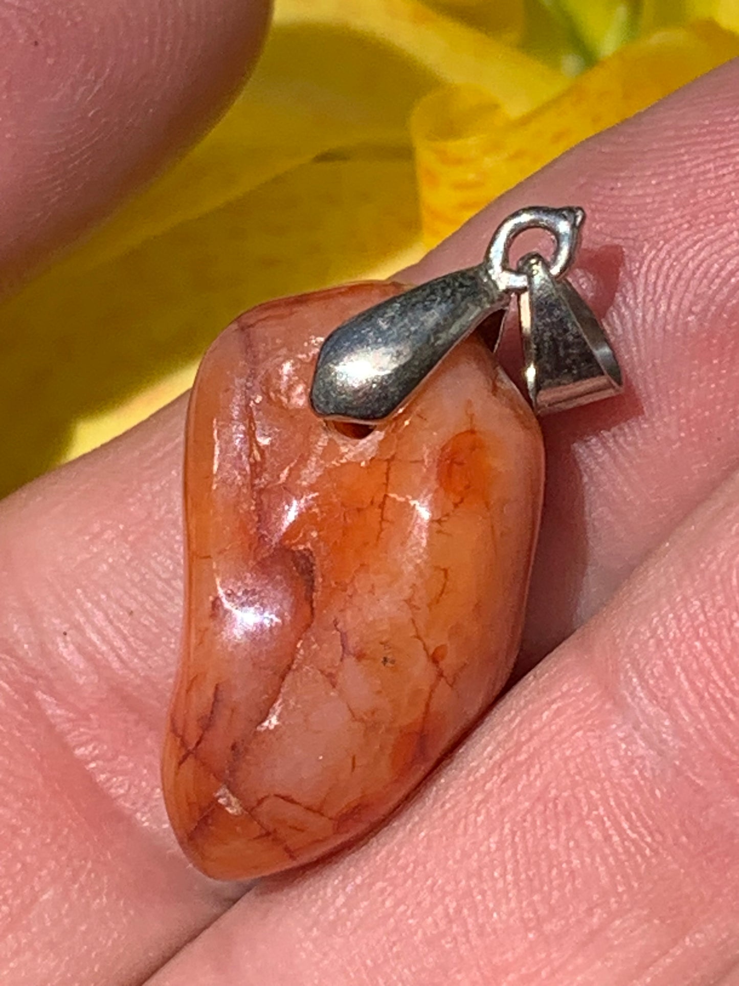 Carnelian pendant made by Gem & Zen, 35mm high x 14mm wide x 10mm thick. Sold with adjustable black cord!