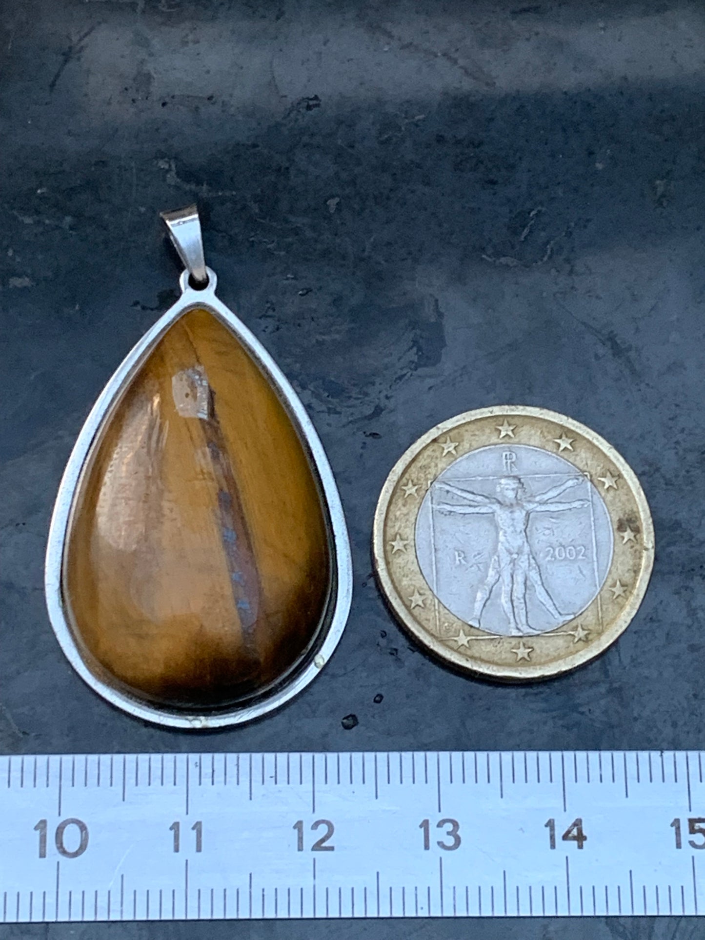 Tiger's Eye, pendant measuring 45mm high x 25mm wide x 8mm thick. Sold with a free adjustable black cord!