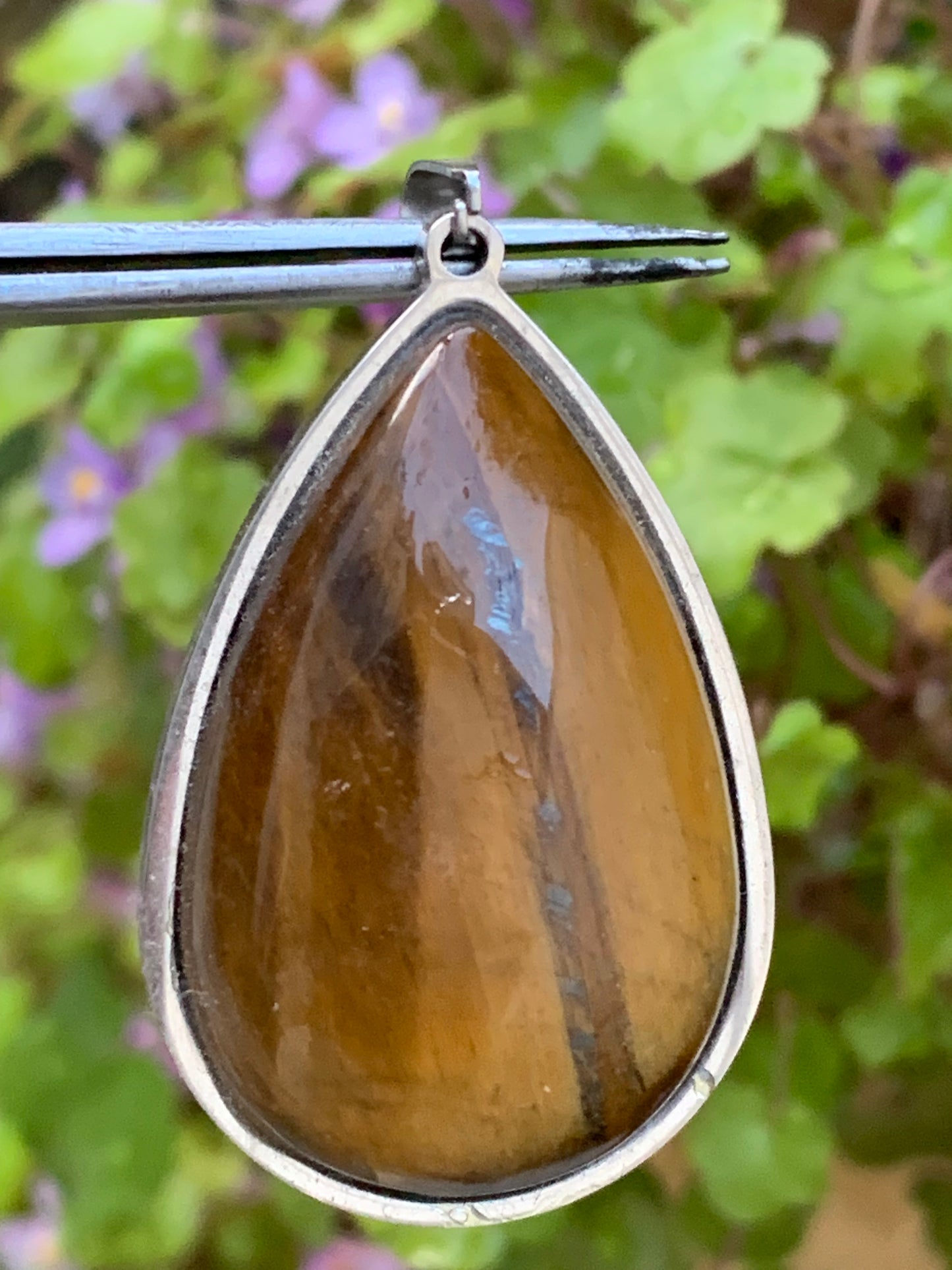 Tiger's Eye, pendant measuring 45mm high x 25mm wide x 8mm thick. Sold with a free adjustable black cord!