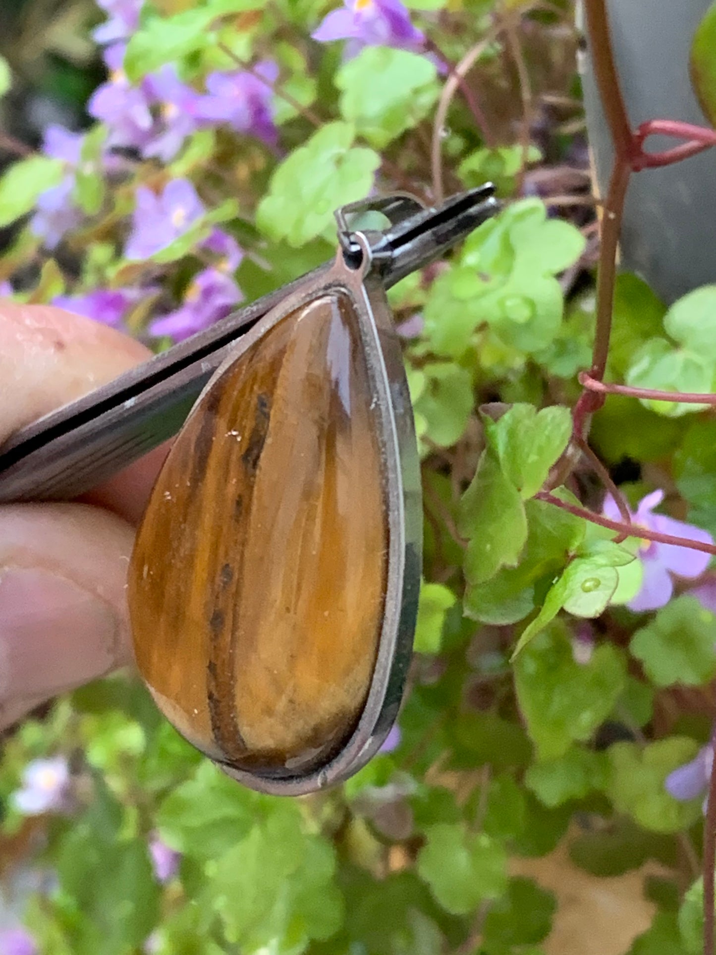 Tiger's Eye, pendant measuring 45mm high x 25mm wide x 8mm thick. Sold with a free adjustable black cord!