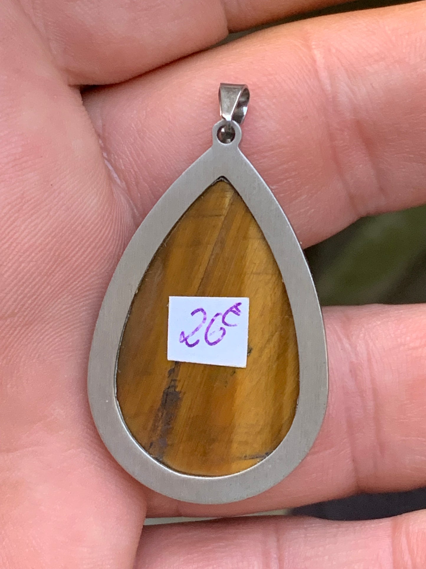Tiger's Eye, pendant measuring 45mm high x 25mm wide x 8mm thick. Sold with a free adjustable black cord!