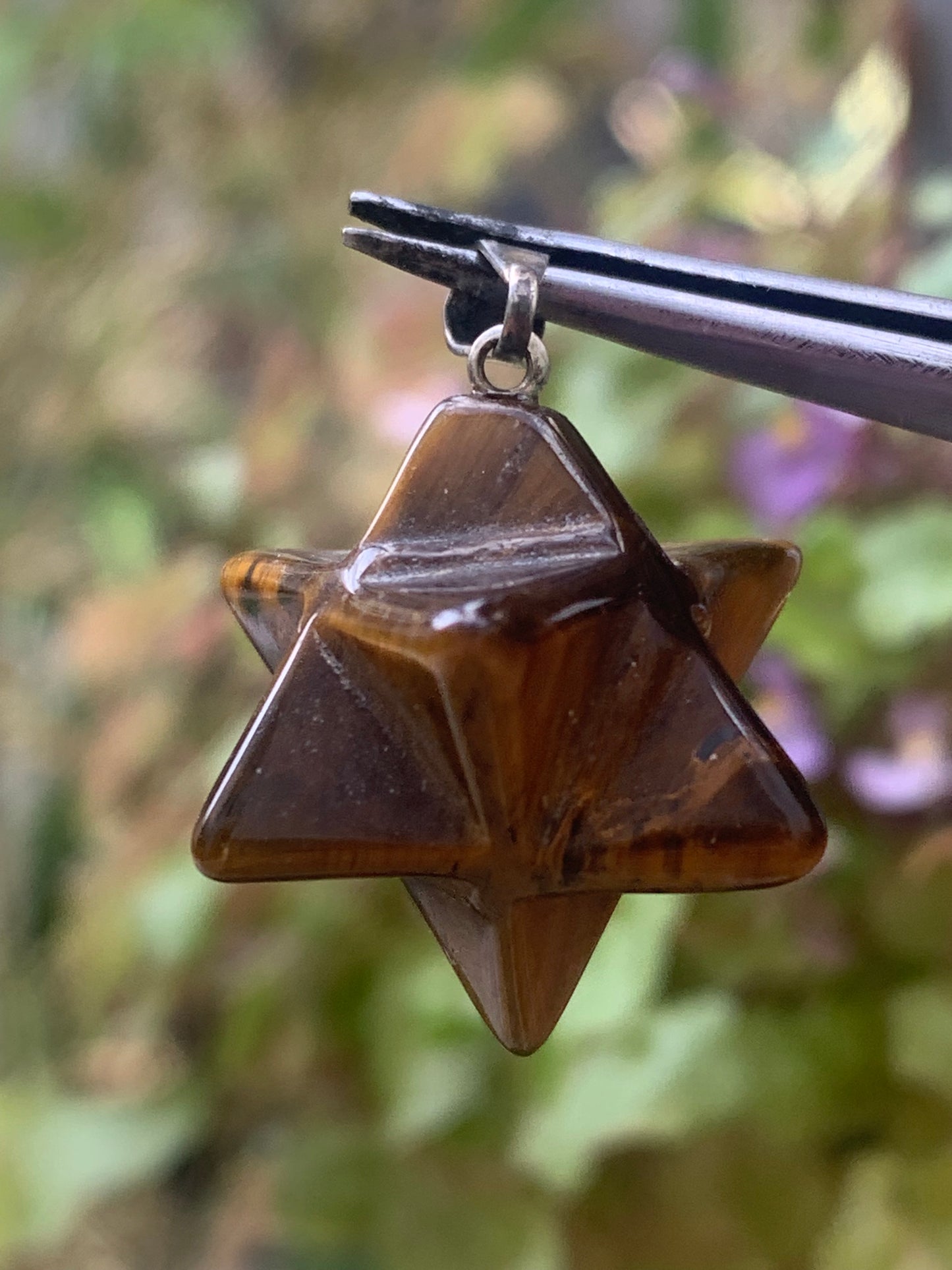 Tiger's Eye, Merkabah (or Merkavah) pendant, 27 millimeters high x 15 mm wide x 15 millimeters. Sold with a free adjustable black cord!