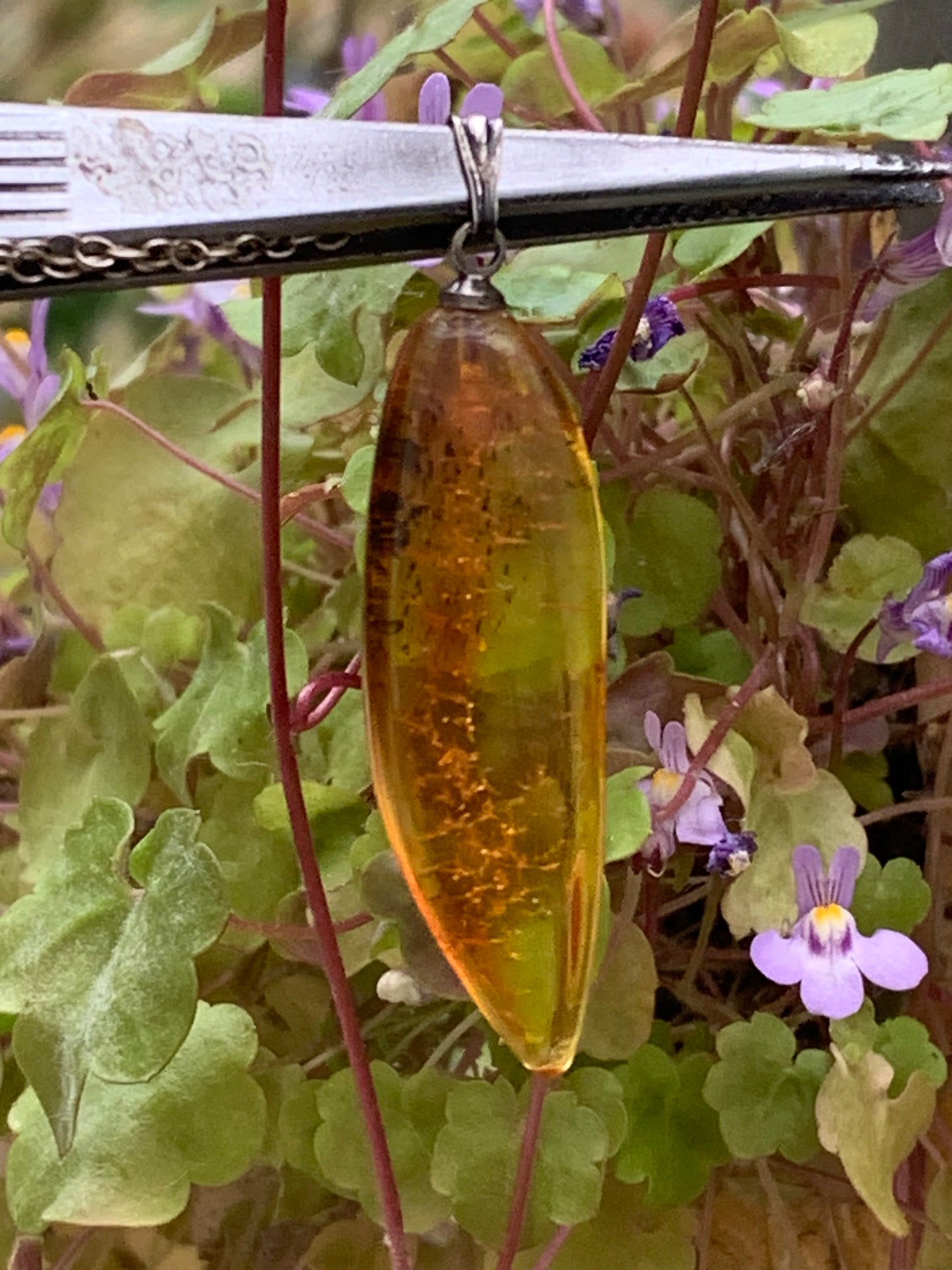 Amber, pendant measuring 40x13x9 millimeters, sold with a sliding (adjustable) black leather cord from 40 to 70 centimeters!