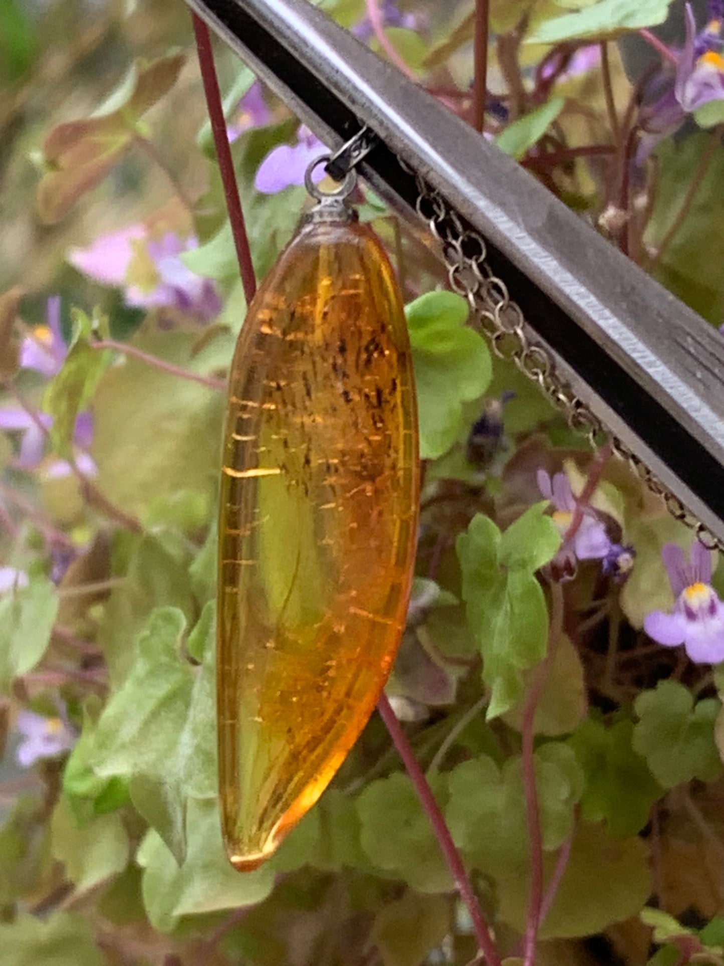 Amber, pendant measuring 40x13x9 millimeters, sold with a sliding (adjustable) black leather cord from 40 to 70 centimeters!