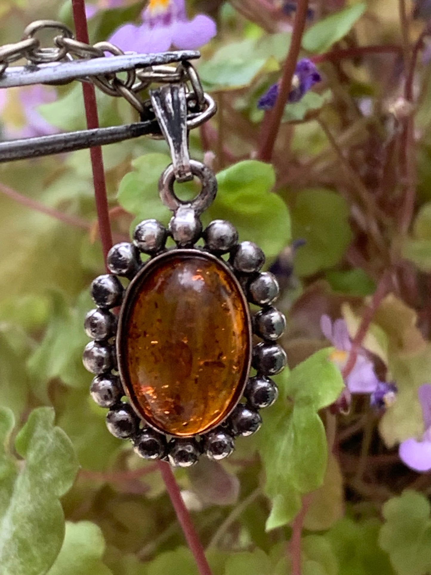 Amber, pendant measuring 25x13x5 millimeters, sold with a 42 centimeter black leather cord!