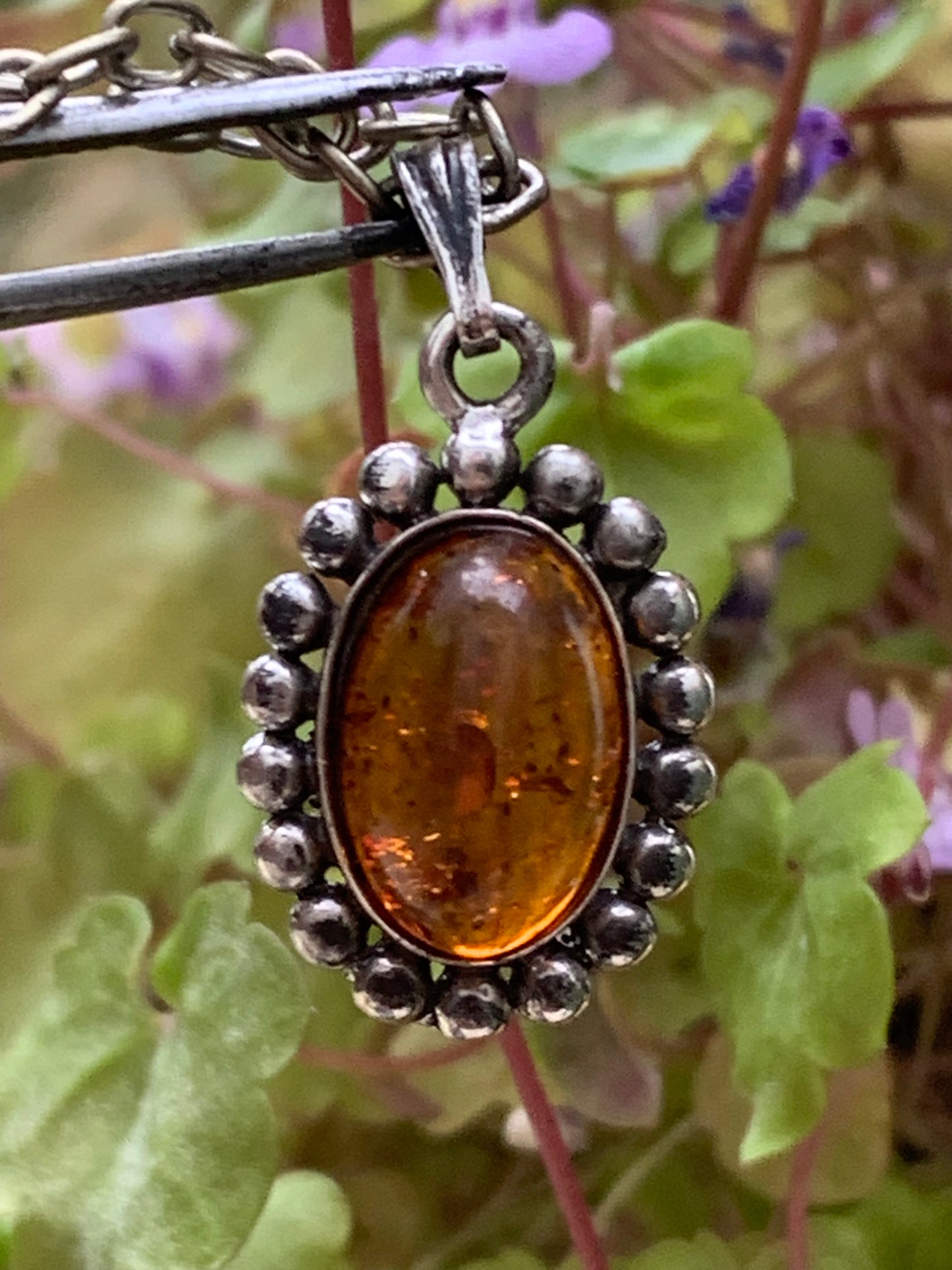 Amber, pendant measuring 25x13x5 millimeters, sold with a 42 centimeter black leather cord!