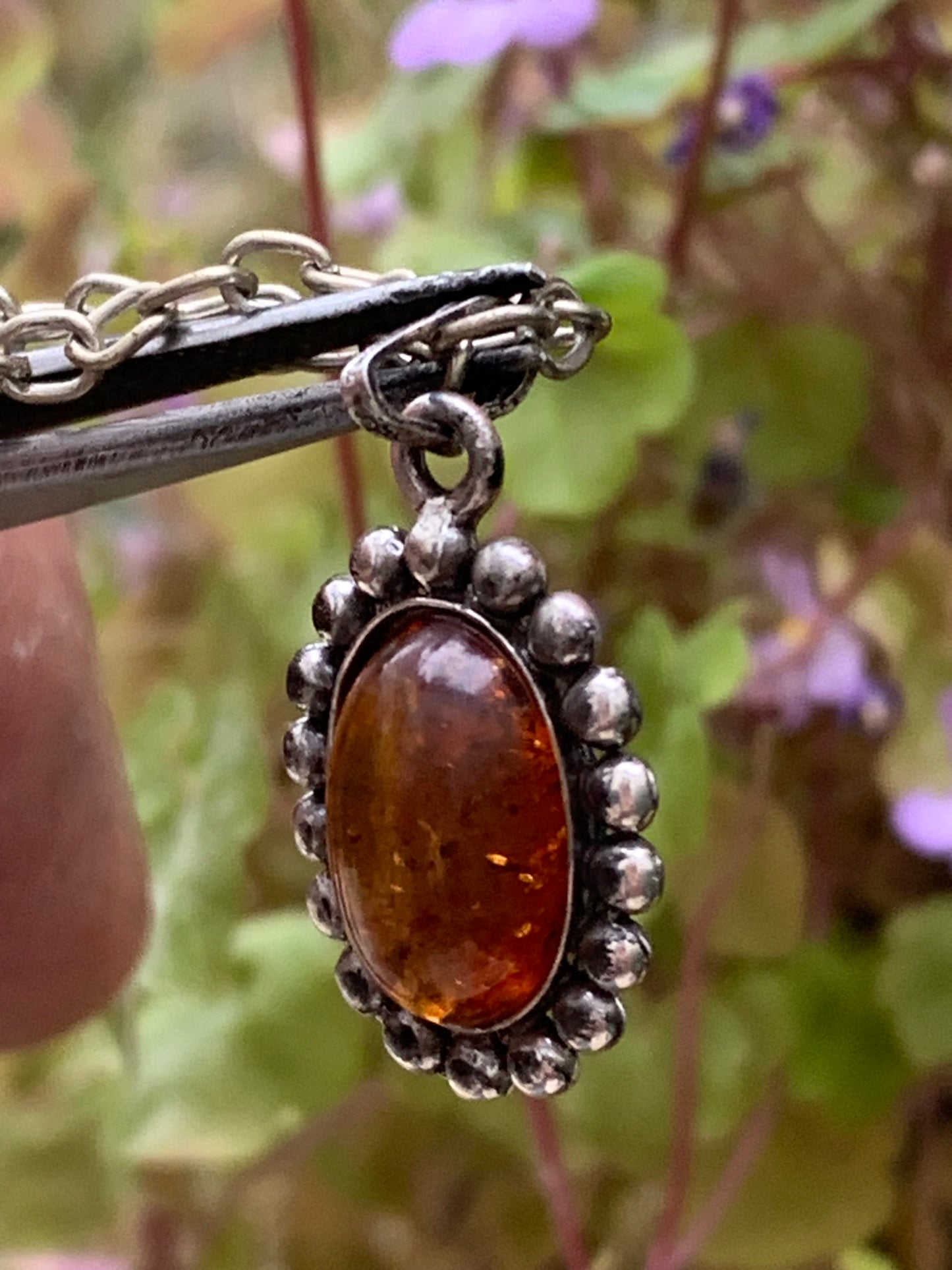 Amber, pendant measuring 25x13x5 millimeters, sold with a 42 centimeter black leather cord!