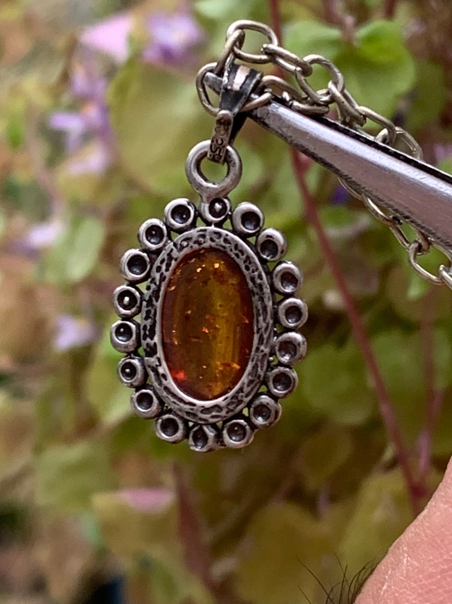 Amber, pendant measuring 25x13x5 millimeters, sold with a 42 centimeter black leather cord!