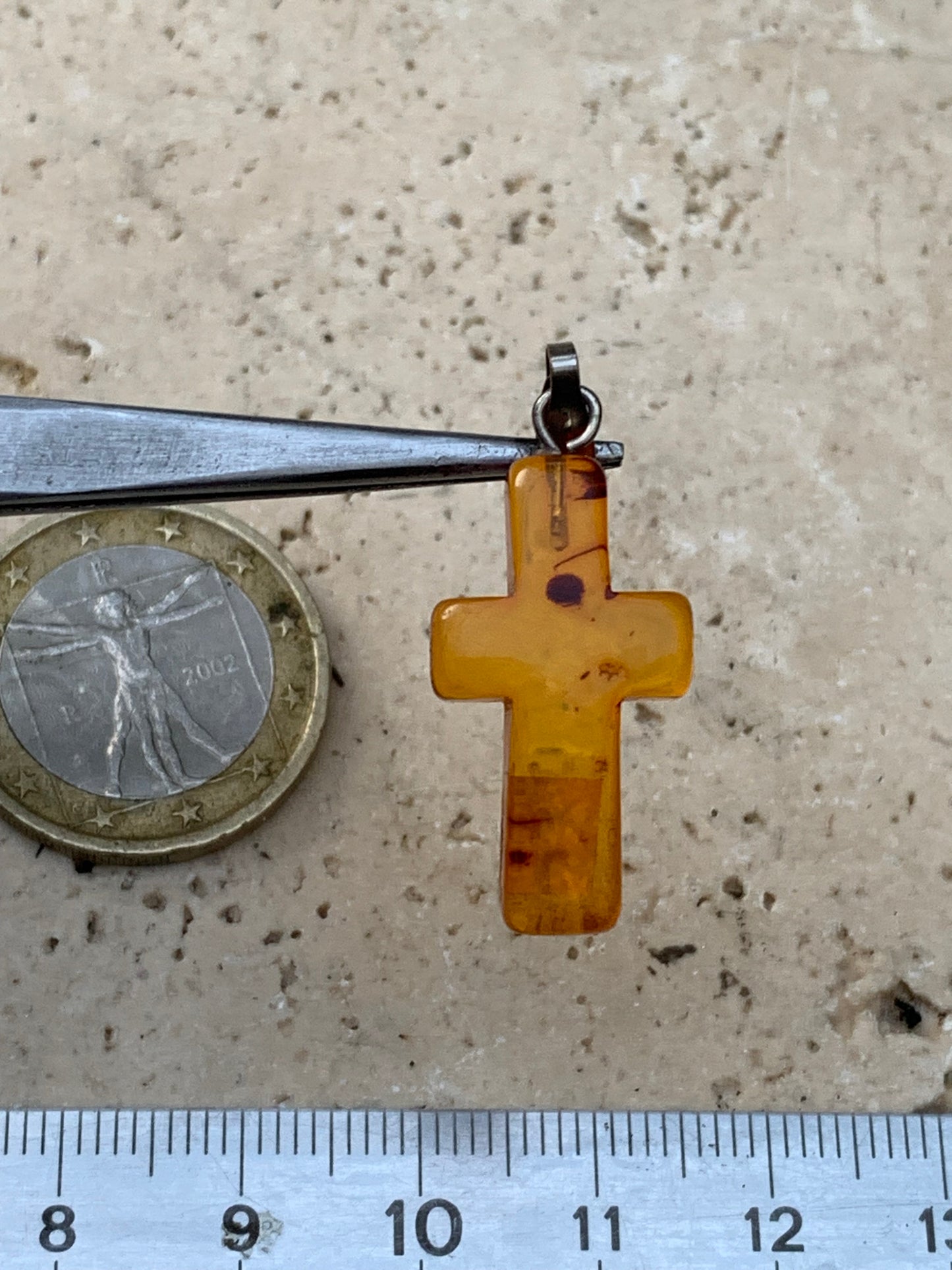 Amber, 'cross' shaped pendant measuring 34x14x5 millimeters, sold with a sliding (adjustable) black leather cord measuring 40 to 70 centimeters!