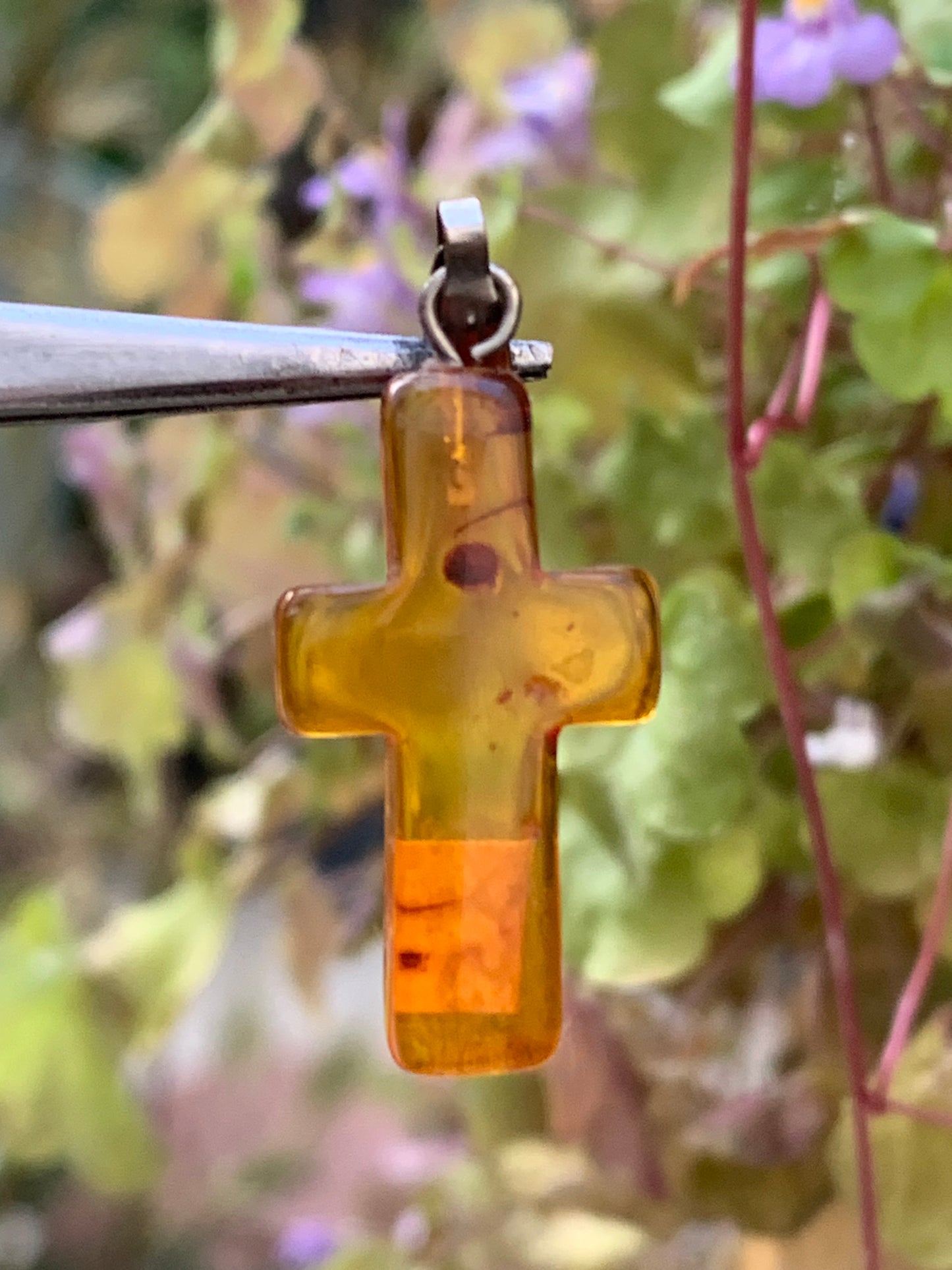 Amber, 'cross' shaped pendant measuring 34x14x5 millimeters, sold with a sliding (adjustable) black leather cord measuring 40 to 70 centimeters!