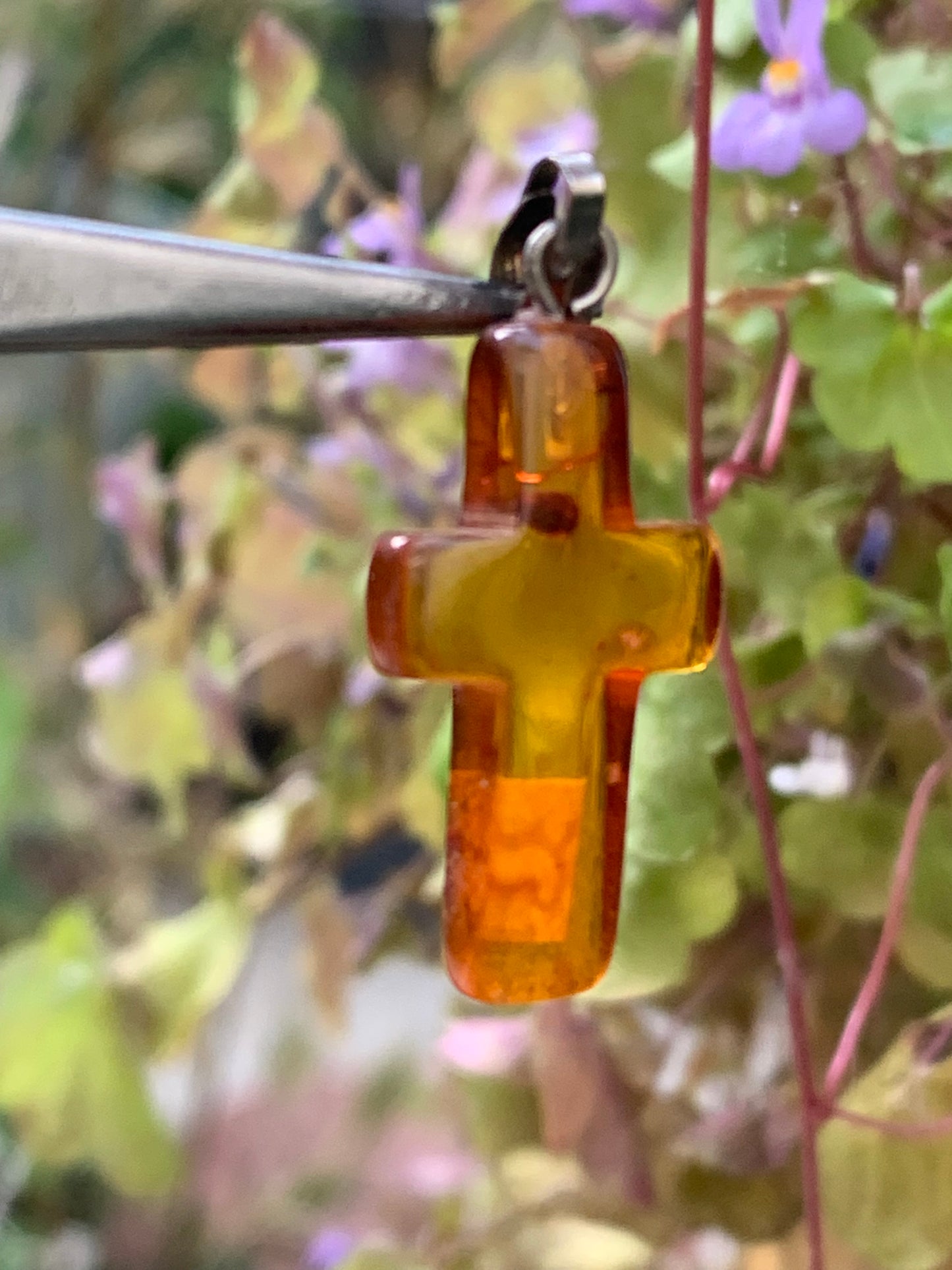 Amber, 'cross' shaped pendant measuring 34x14x5 millimeters, sold with a sliding (adjustable) black leather cord measuring 40 to 70 centimeters!